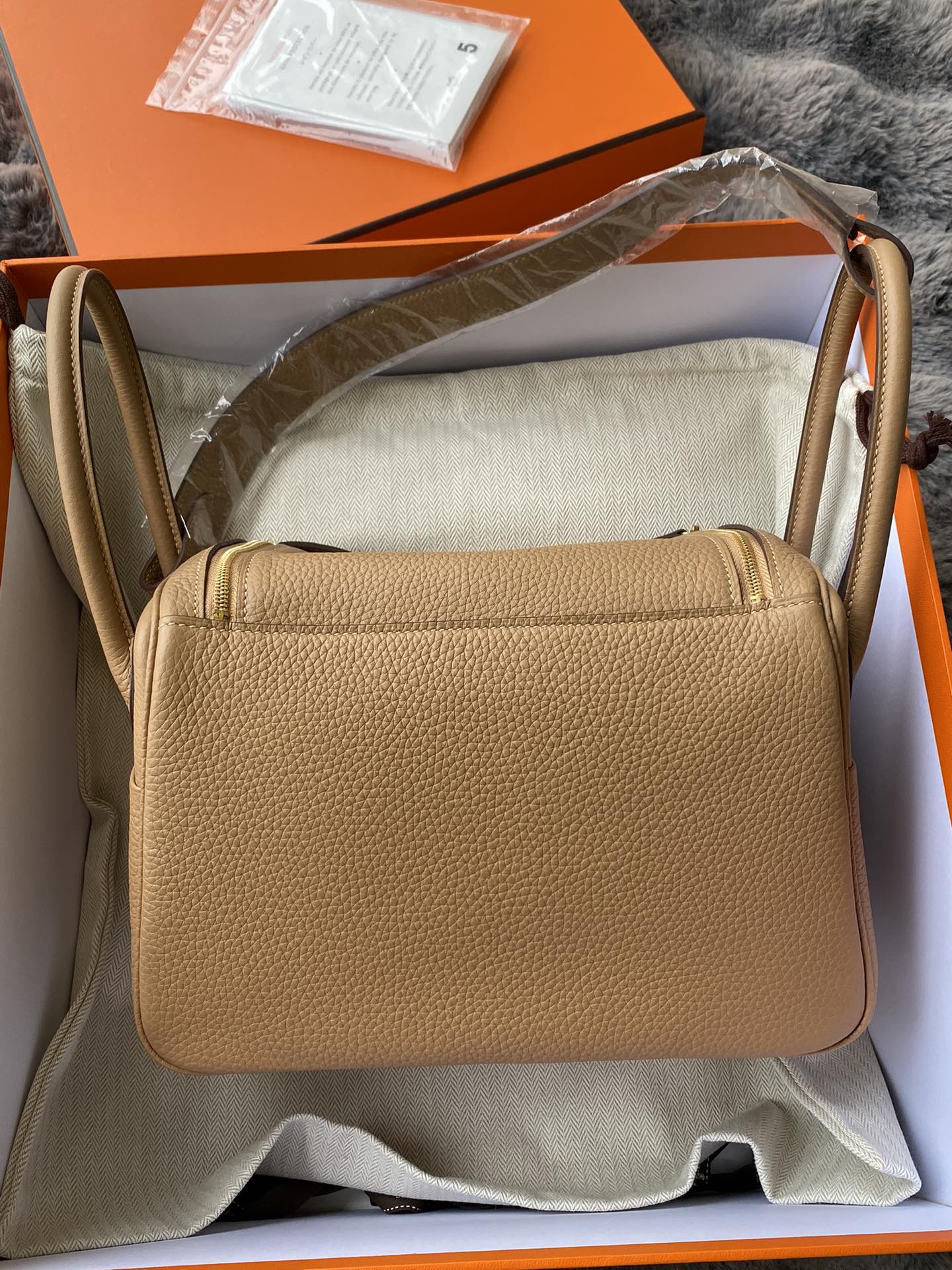 Hermès Lindy Handbag in Tan Leather with Gold-Tone Hardware