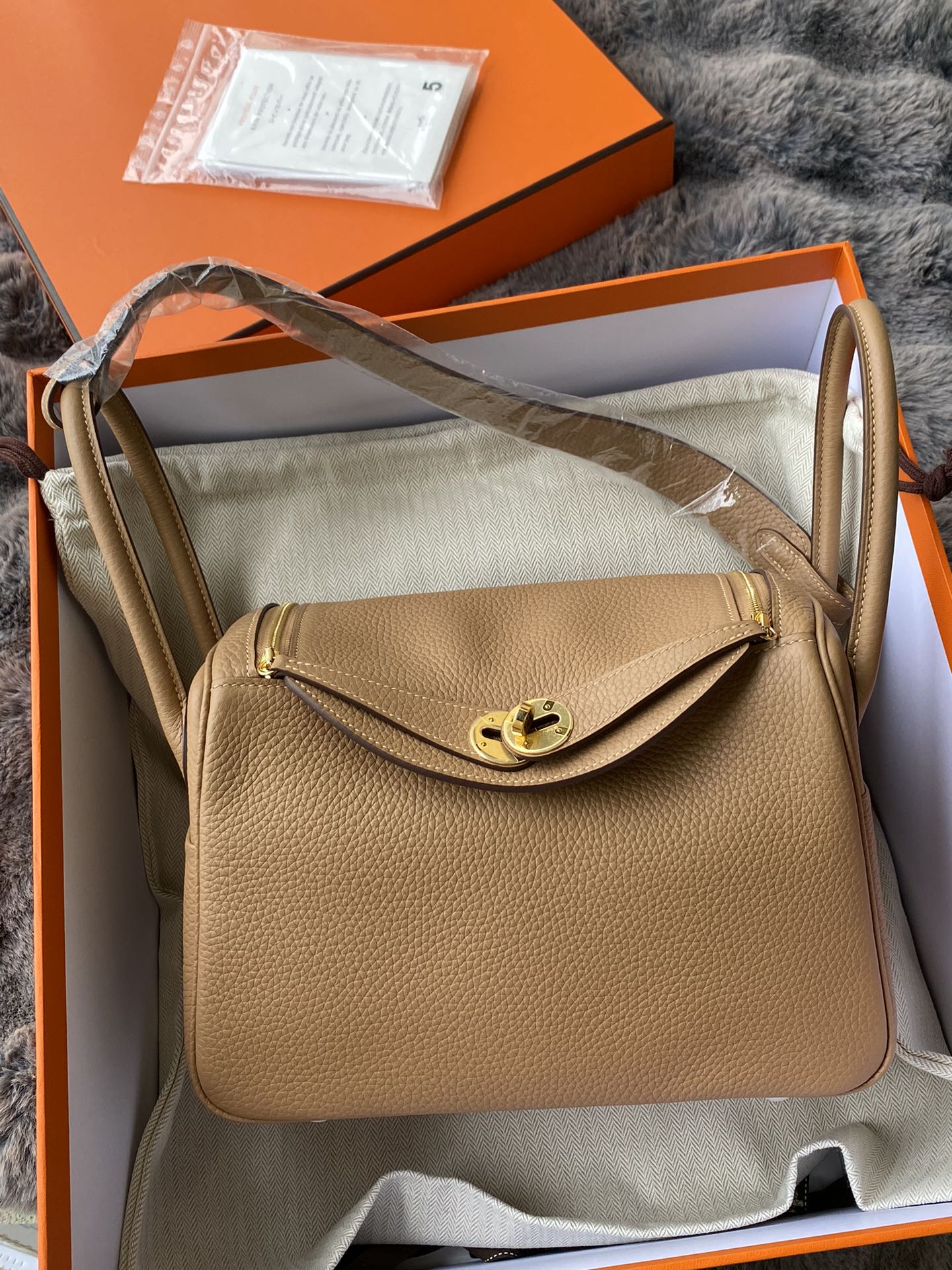Hermès Lindy Handbag in Tan Leather with Gold-Tone Hardware