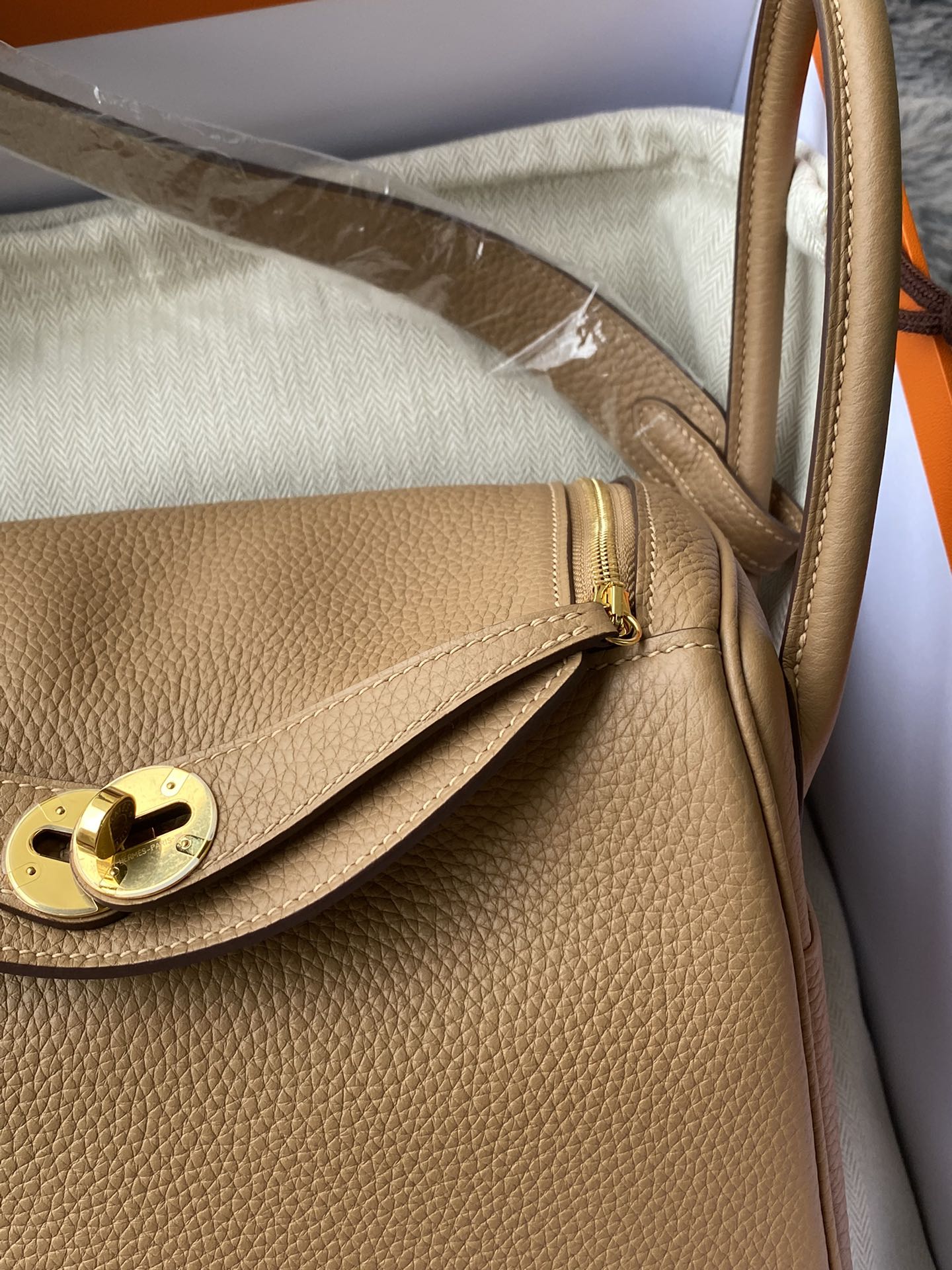 Hermès Lindy Handbag in Tan Leather with Gold-Tone Hardware