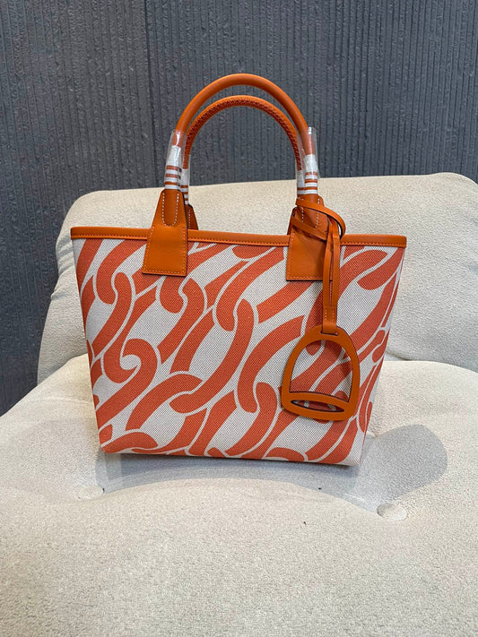 Orange Chain Link Pattern Canvas Tote Bag with Leather Top Handles and Stirrup Charm