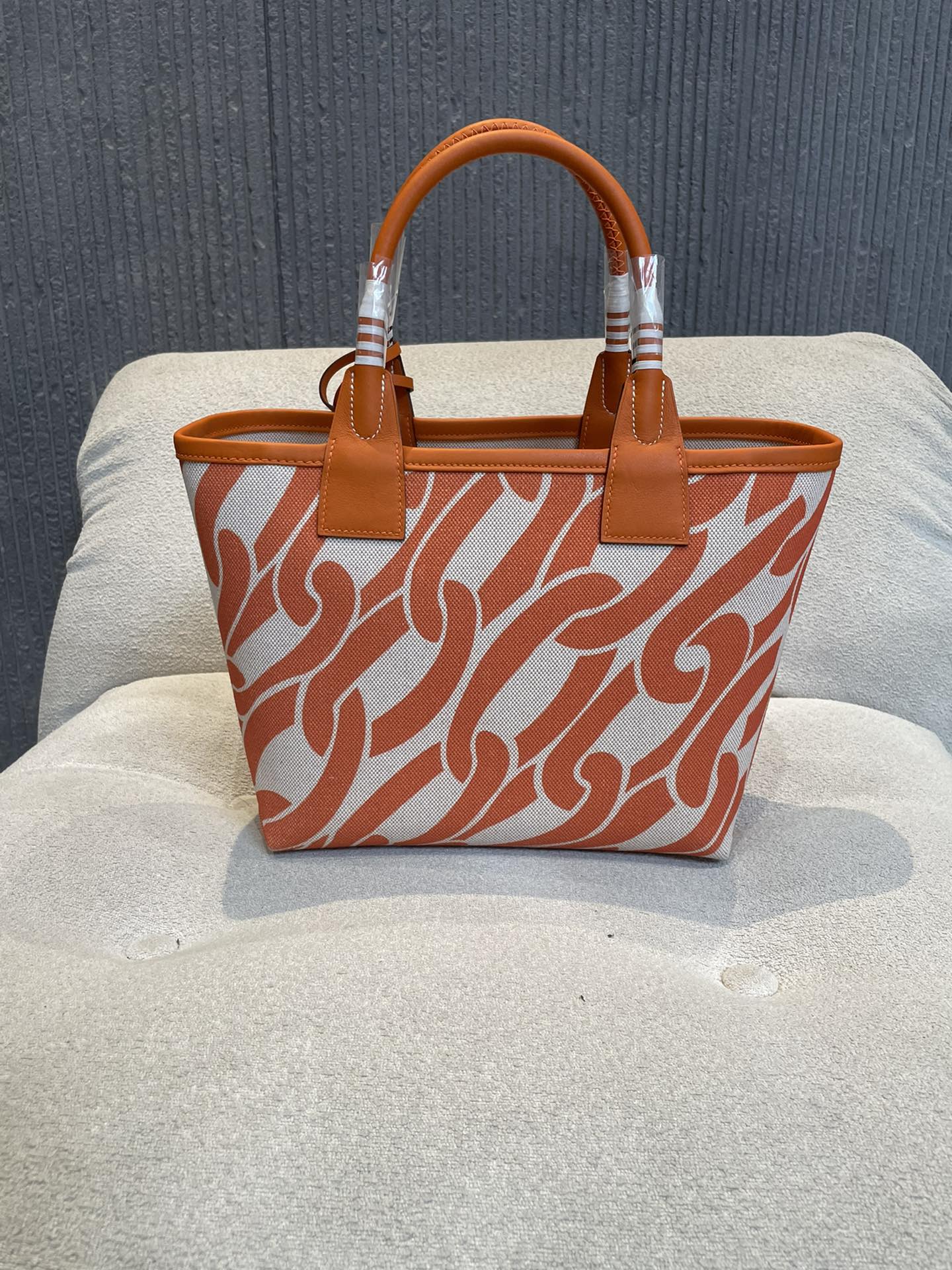 Orange Chain Link Pattern Canvas Tote Bag with Leather Top Handles and Stirrup Charm