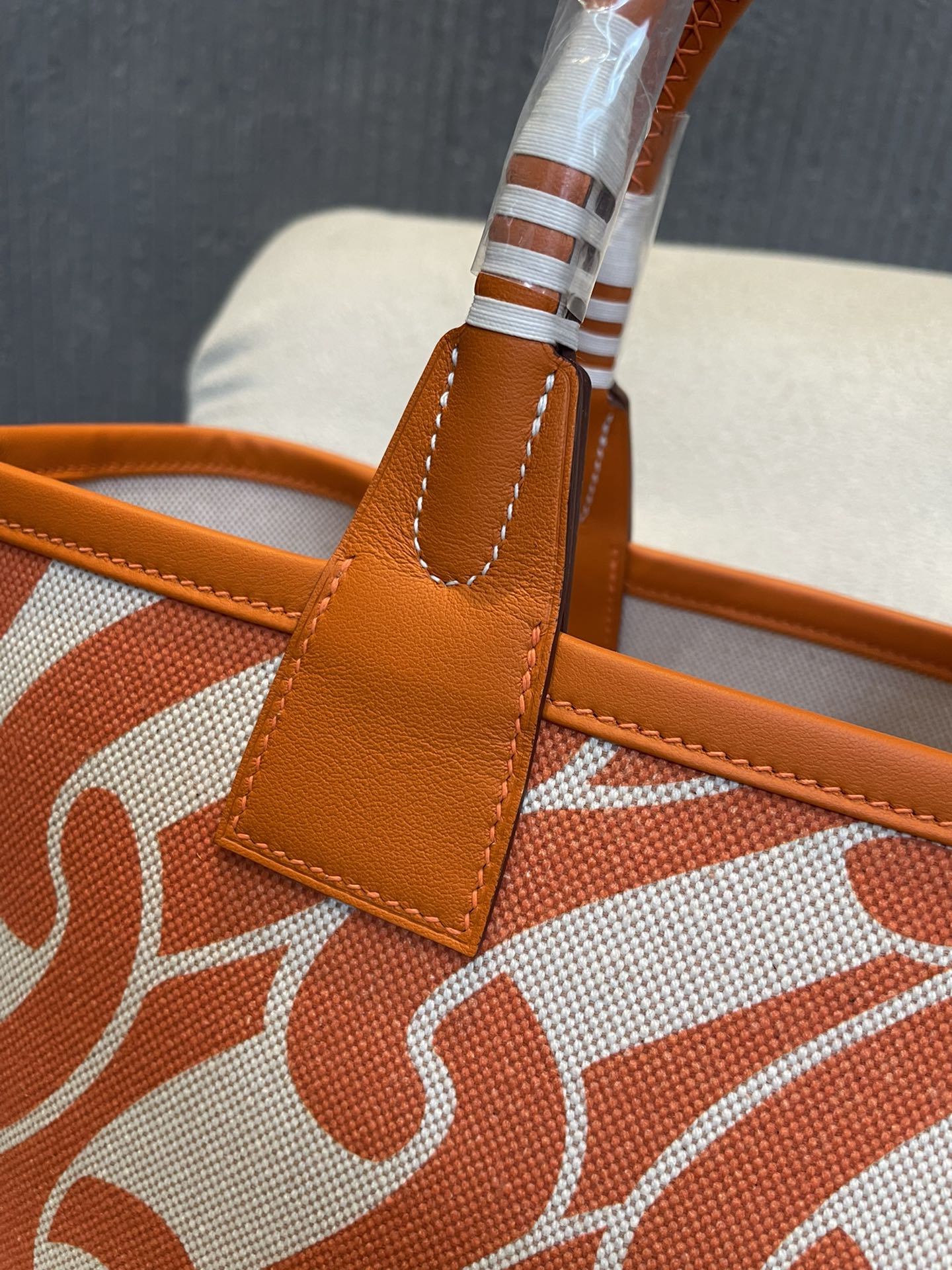 Orange Chain Link Pattern Canvas Tote Bag with Leather Top Handles and Stirrup Charm