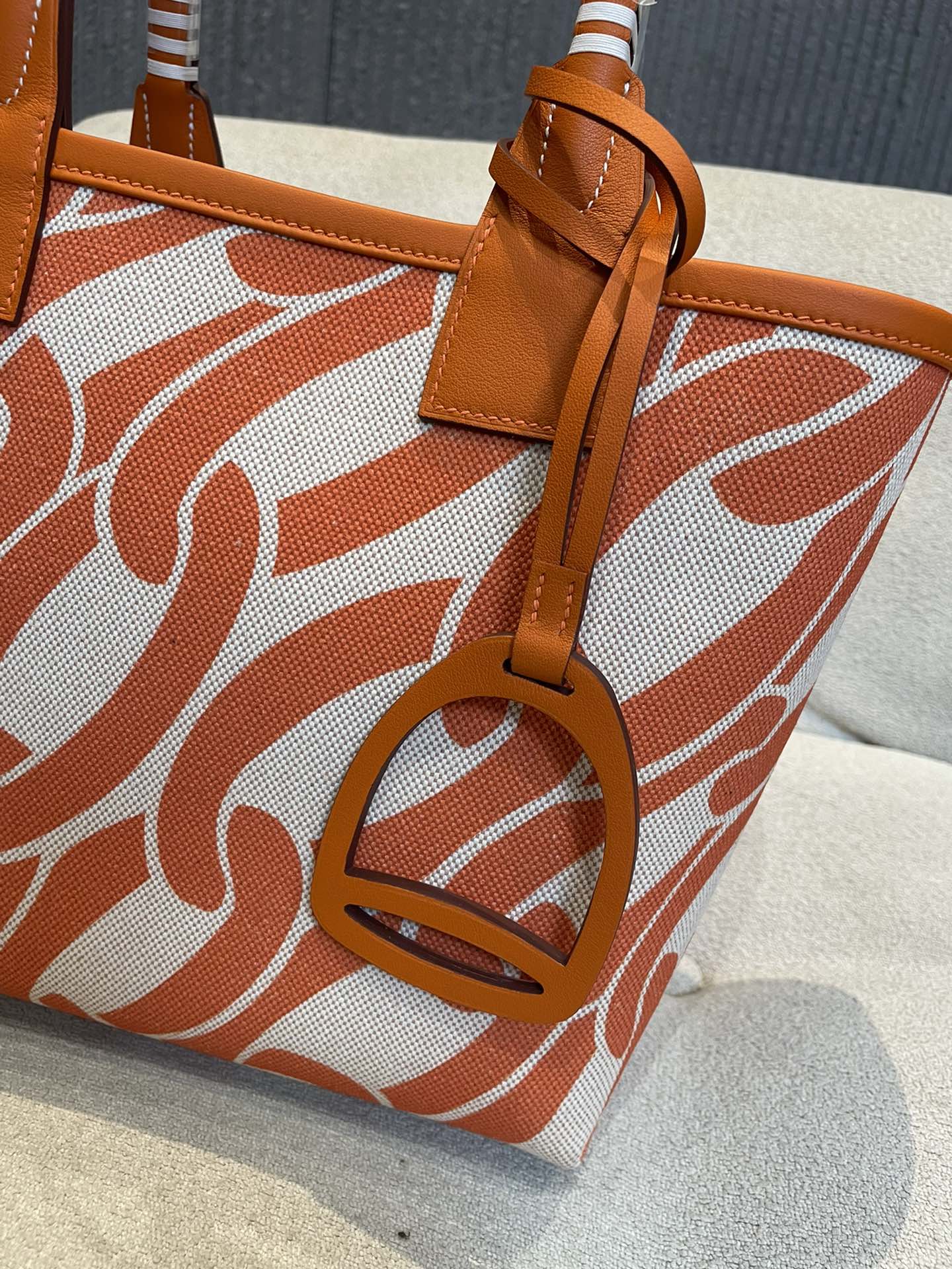 Orange Chain Link Pattern Canvas Tote Bag with Leather Top Handles and Stirrup Charm