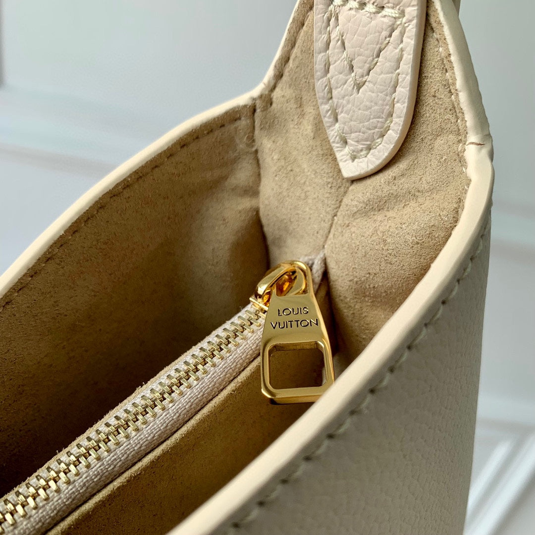 Elegant Cream Leather Crescent Shoulder Bag with Gold Padlock Detail