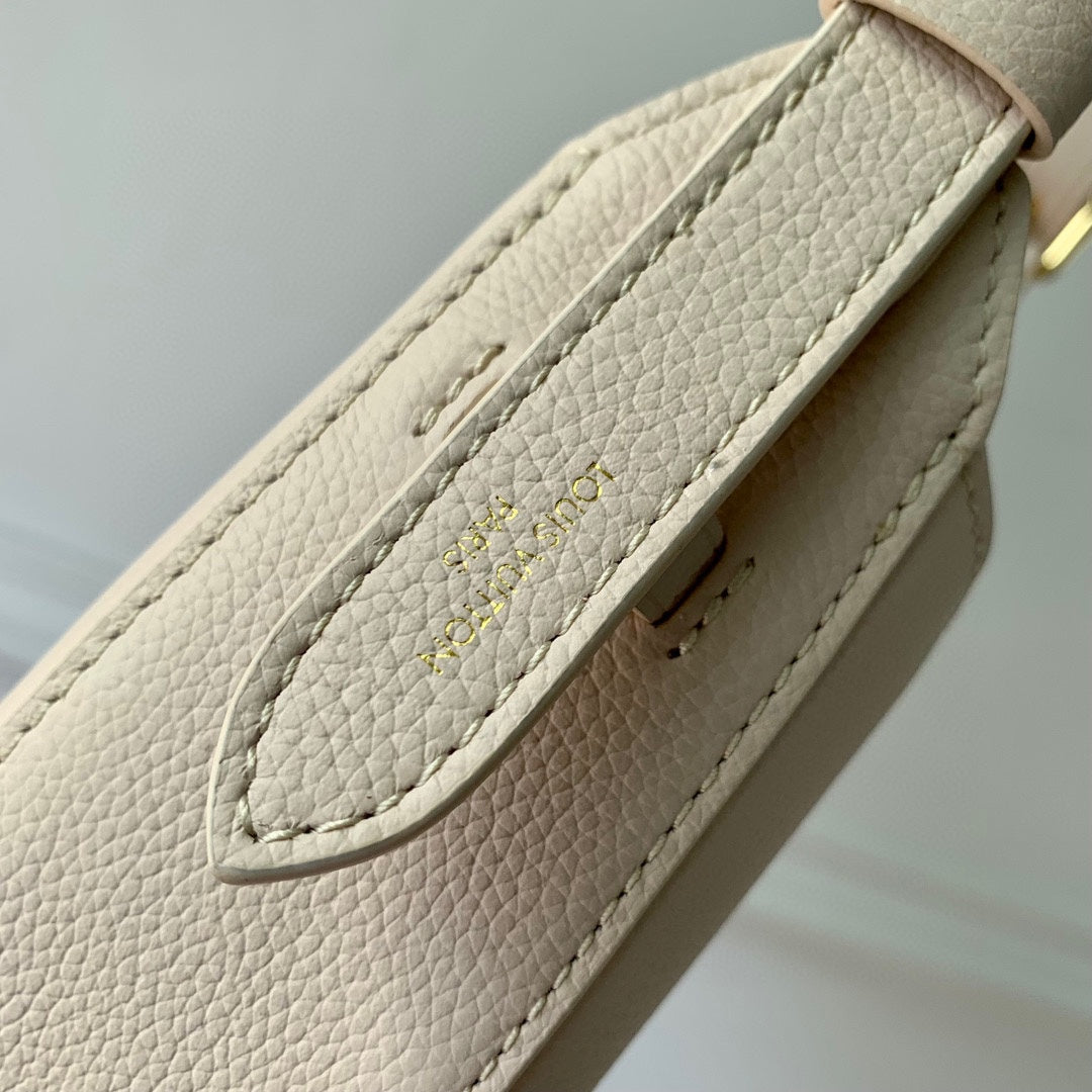 Elegant Cream Leather Crescent Shoulder Bag with Gold Padlock Detail
