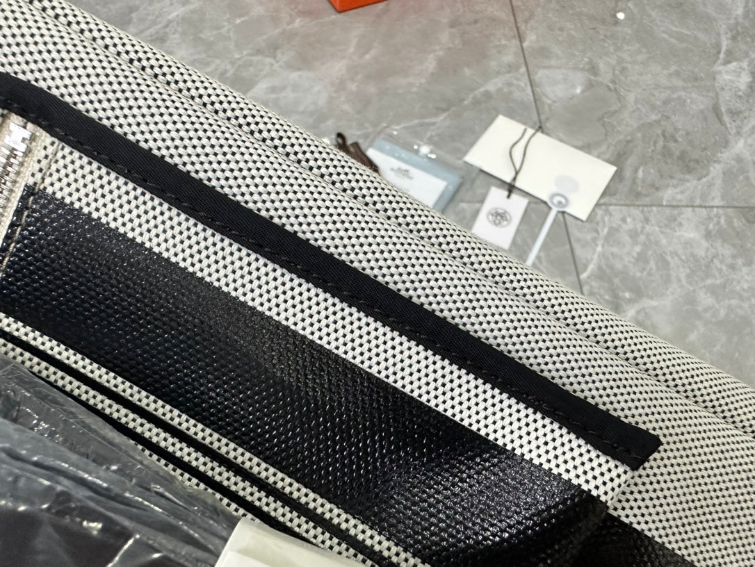 Designer-Inspired Grey and White Striped Canvas Handbag with Black Leather Flap