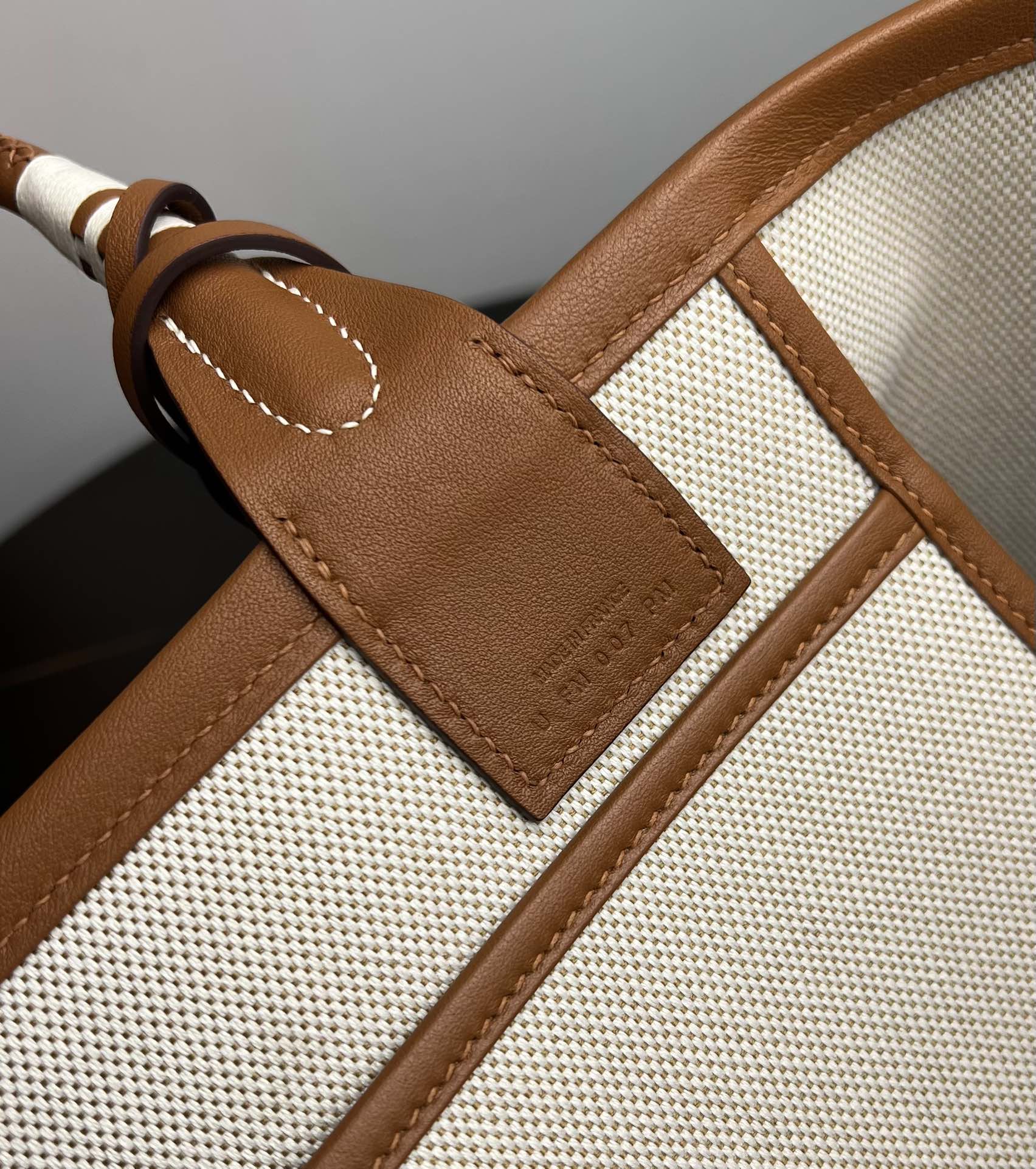 Luxury Stirrup Print Canvas Handbag with Brown Leather Detail