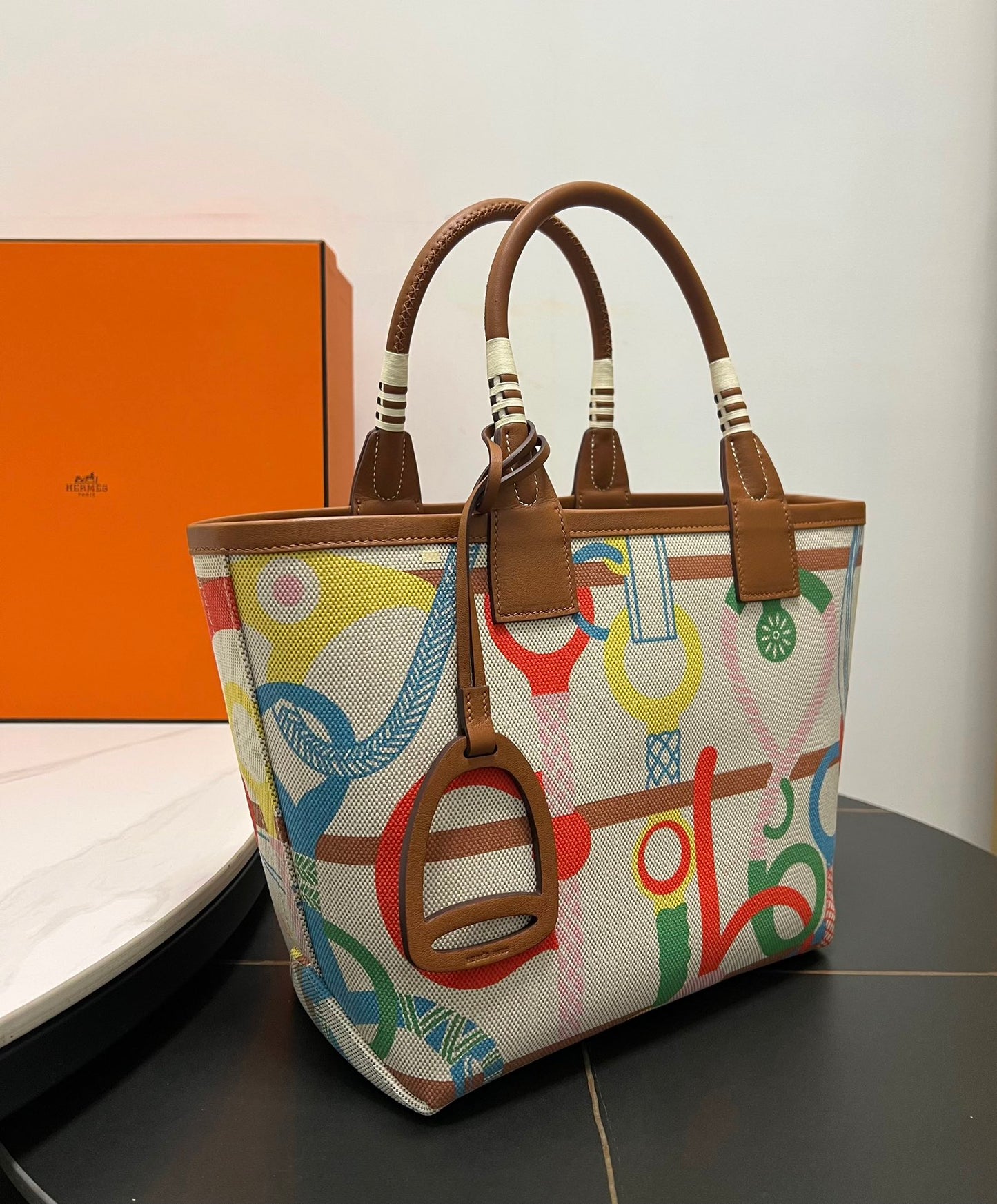Luxury Stirrup Print Canvas Handbag with Brown Leather Detail