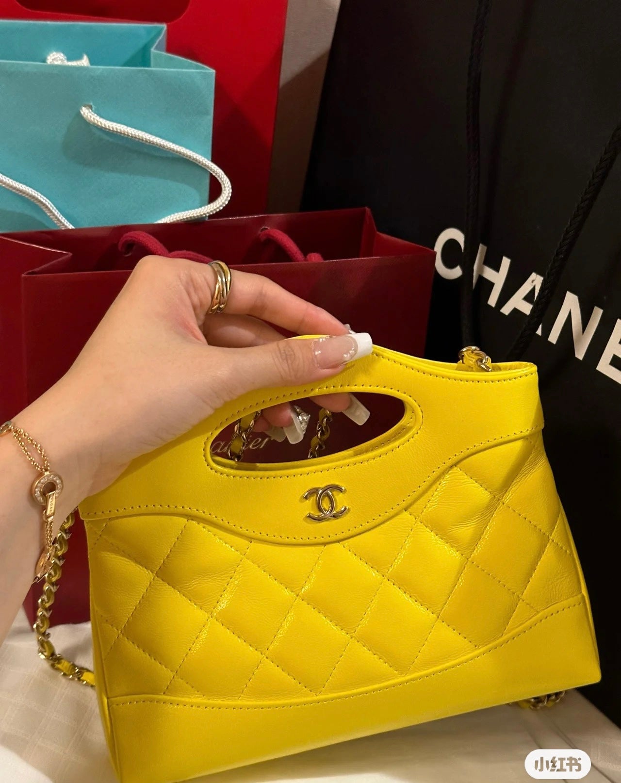 Yellow Quilted Mini Handbag with Gold Chain Strap and Top Handle