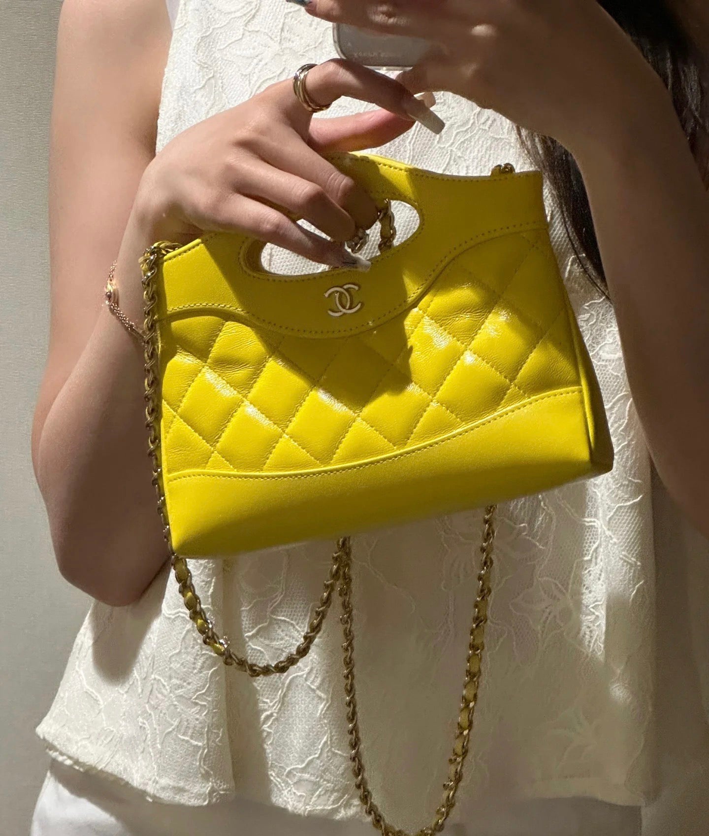Yellow Quilted Mini Handbag with Gold Chain Strap and Top Handle