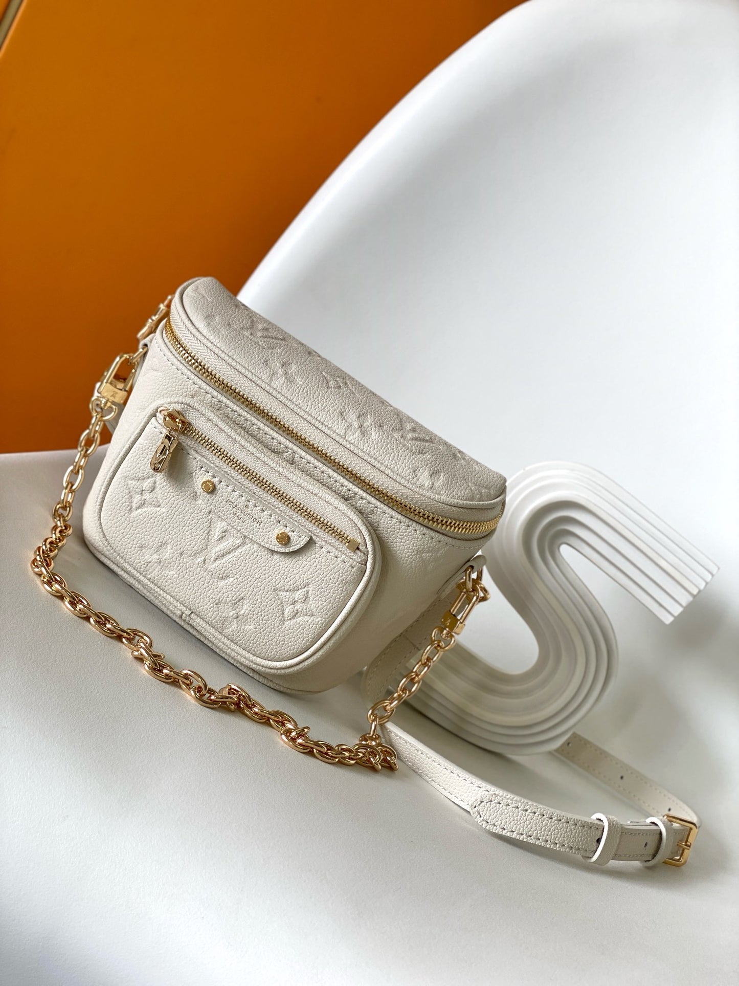 Louis Vuitton Elegant Cream Embossed Leather Crossbody Bag with Gold Chain