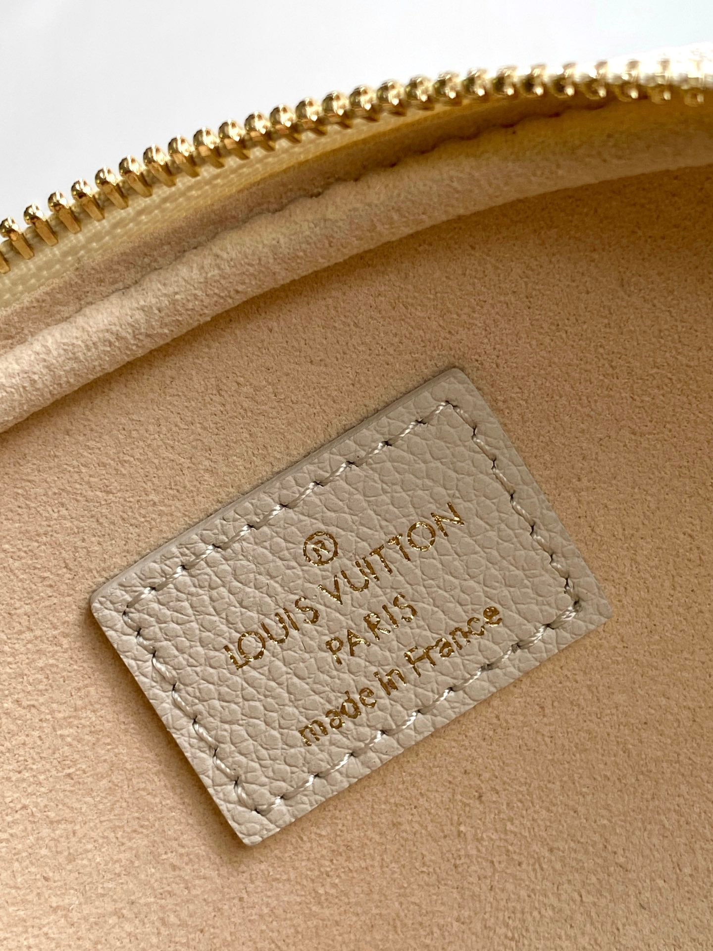 Louis Vuitton Elegant Cream Embossed Leather Crossbody Bag with Gold Chain