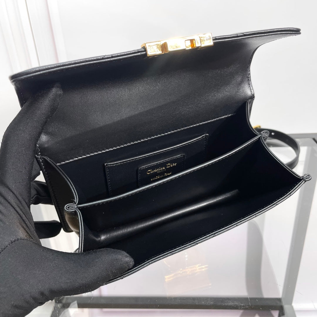 Black Quilted Leather Top Handle Handbag with Gold-Tone Hardware