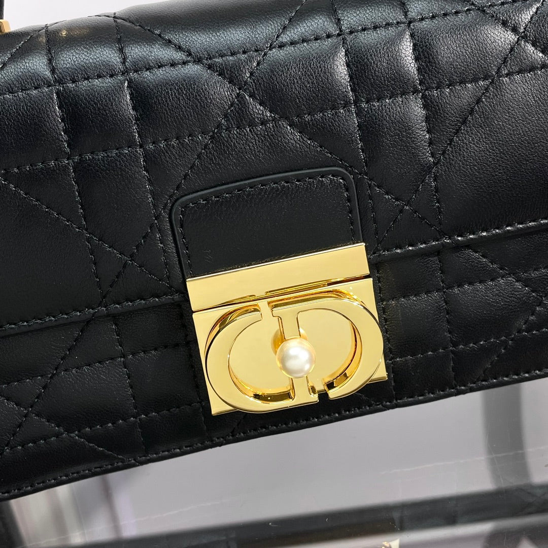 Black Quilted Leather Top Handle Handbag with Gold-Tone Hardware