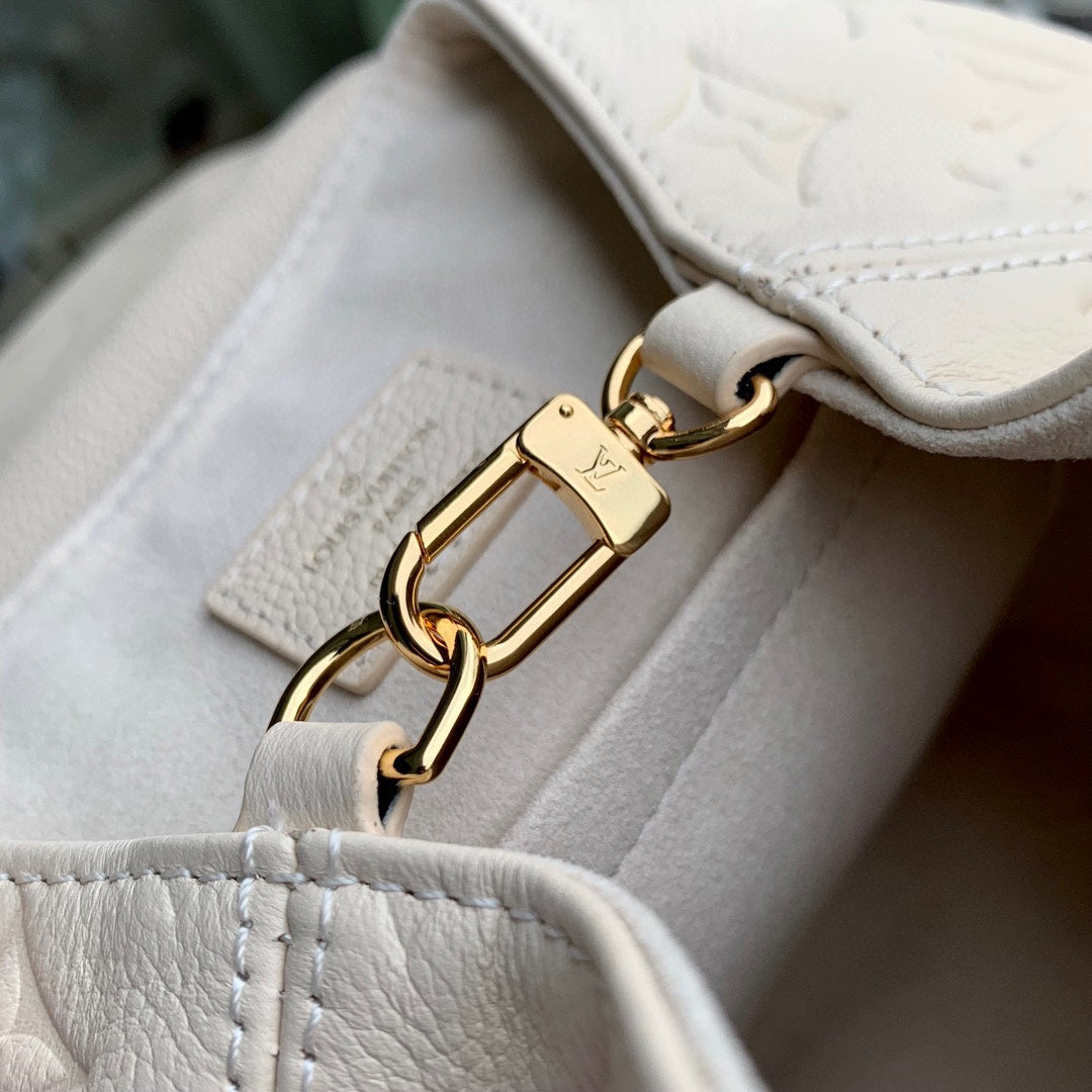Louis Vuitton Montsouris BB Backpack in Monogram Empreinte Leather - Cream