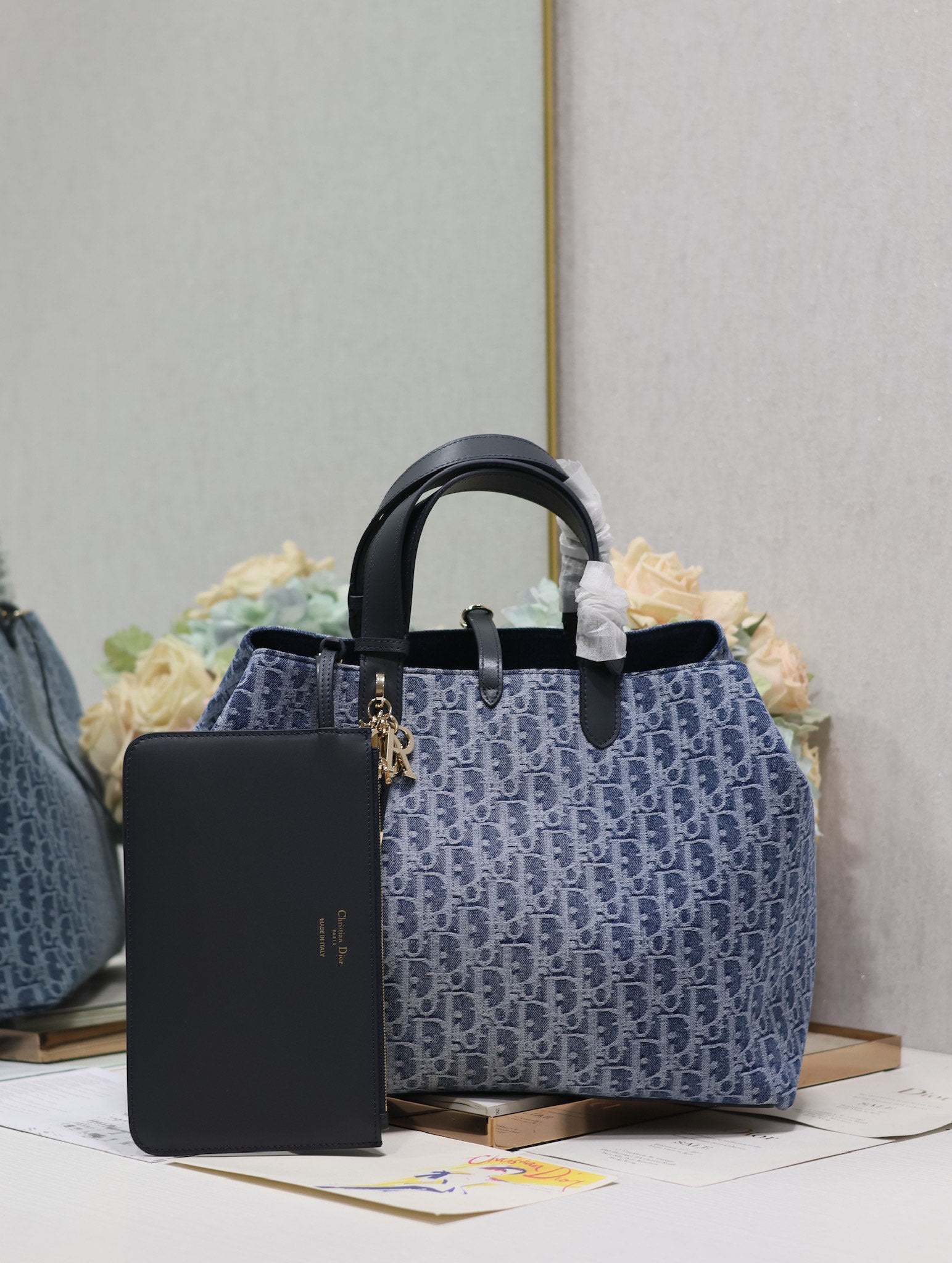 Vintage-Style Blue Monogram Canvas Tote Bag with Black Leather Handles and Gold Charm