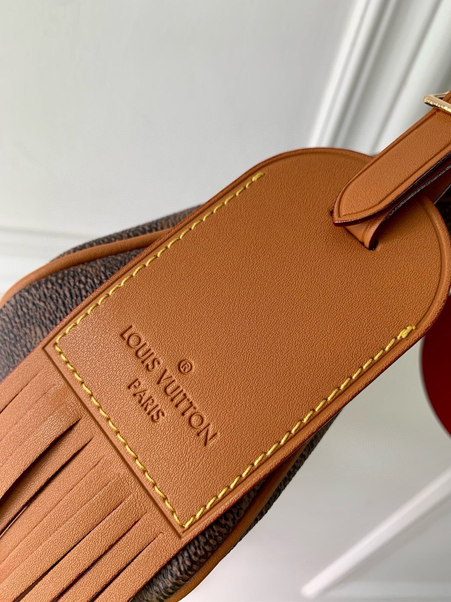 Luxury Monogram Brown Handbag with Tassel Detail - Elegant Designer Style Crossbody Bag