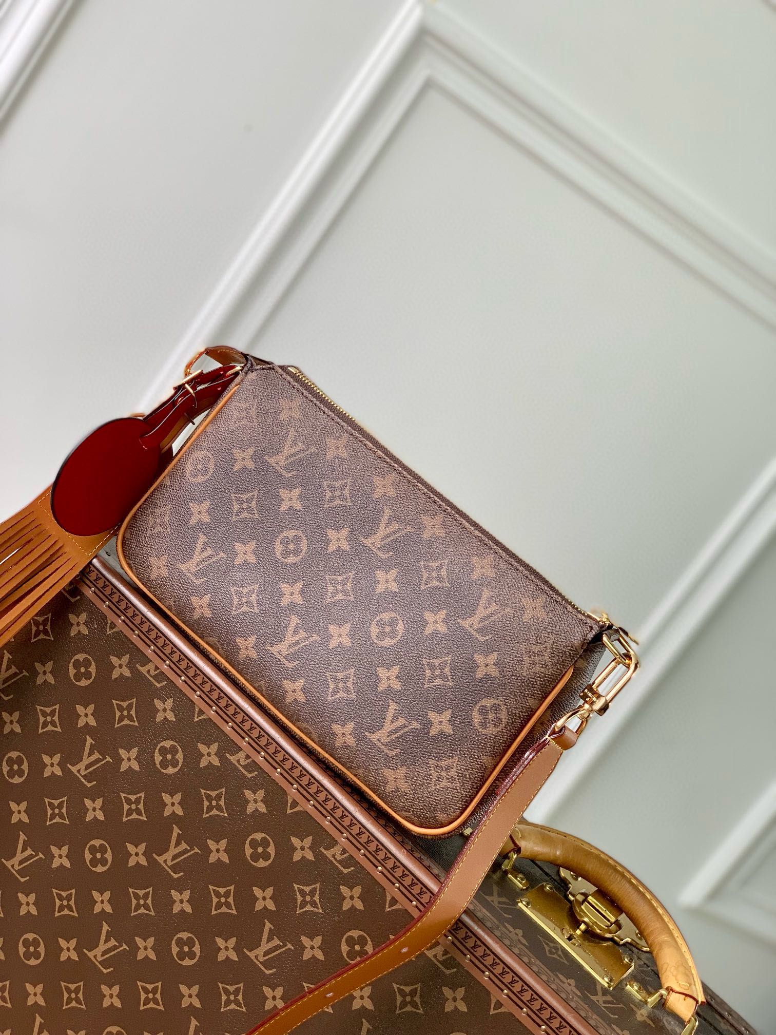 Luxury Monogram Brown Handbag with Tassel Detail - Elegant Designer Style Crossbody Bag