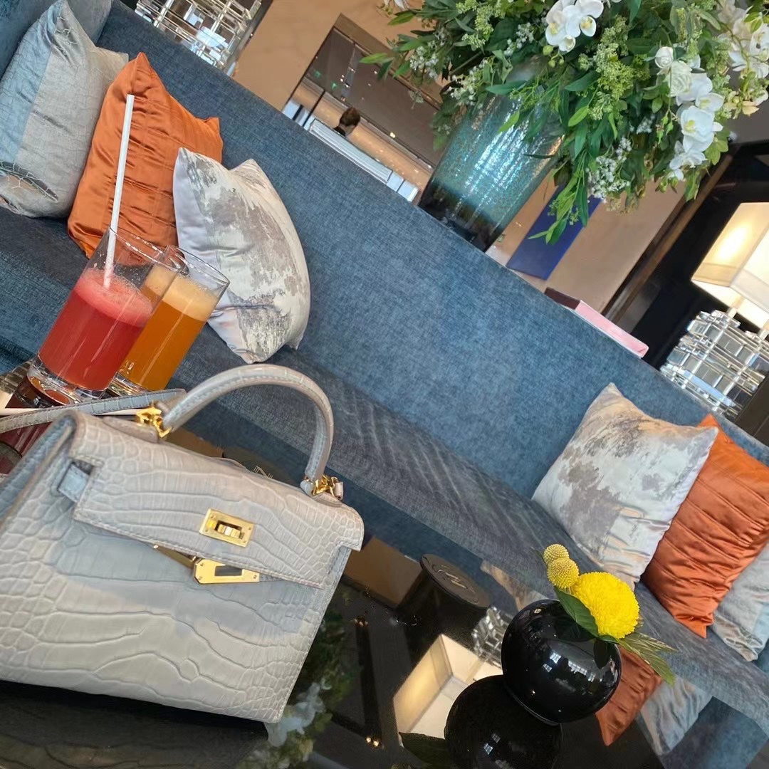 Luxury Textured Gray Top-Handle Handbag with Gold-Tone Hardware