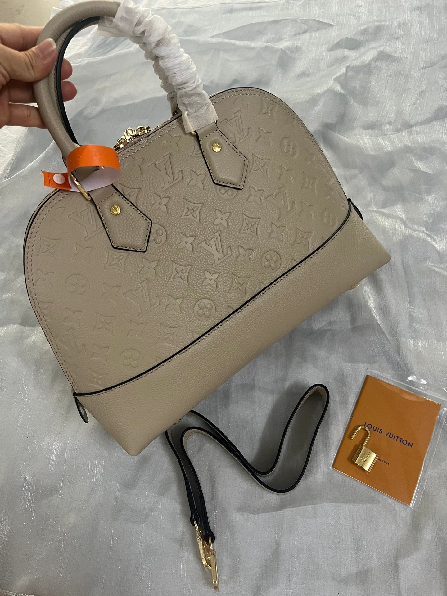 Louis Vuitton Neo Alma PM Monogram Empreinte Leather Turtledove Handbag