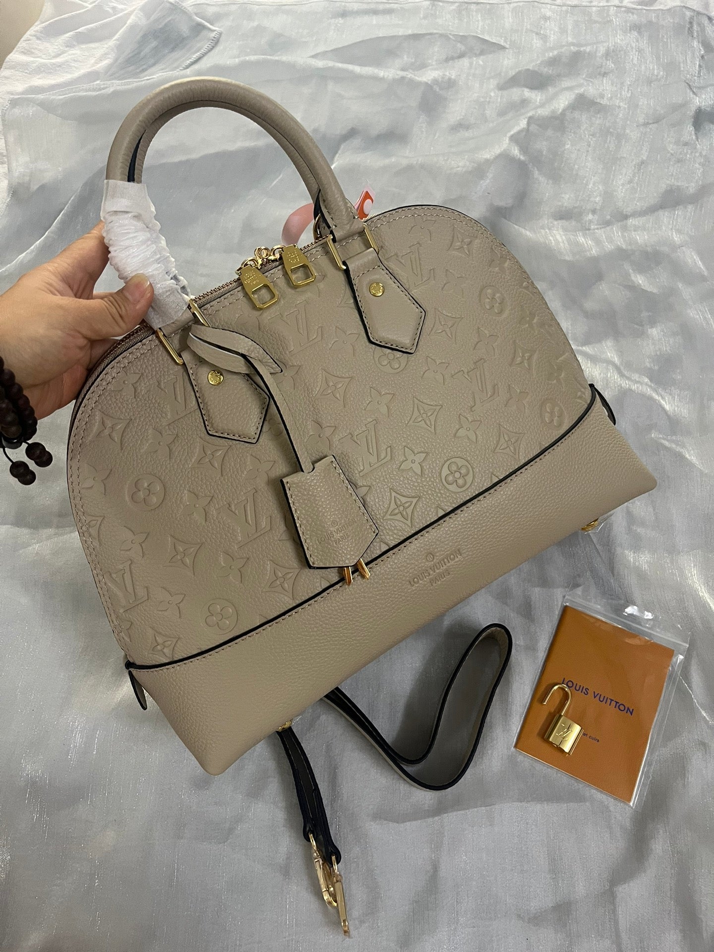 Louis Vuitton Neo Alma PM Monogram Empreinte Leather Turtledove Handbag