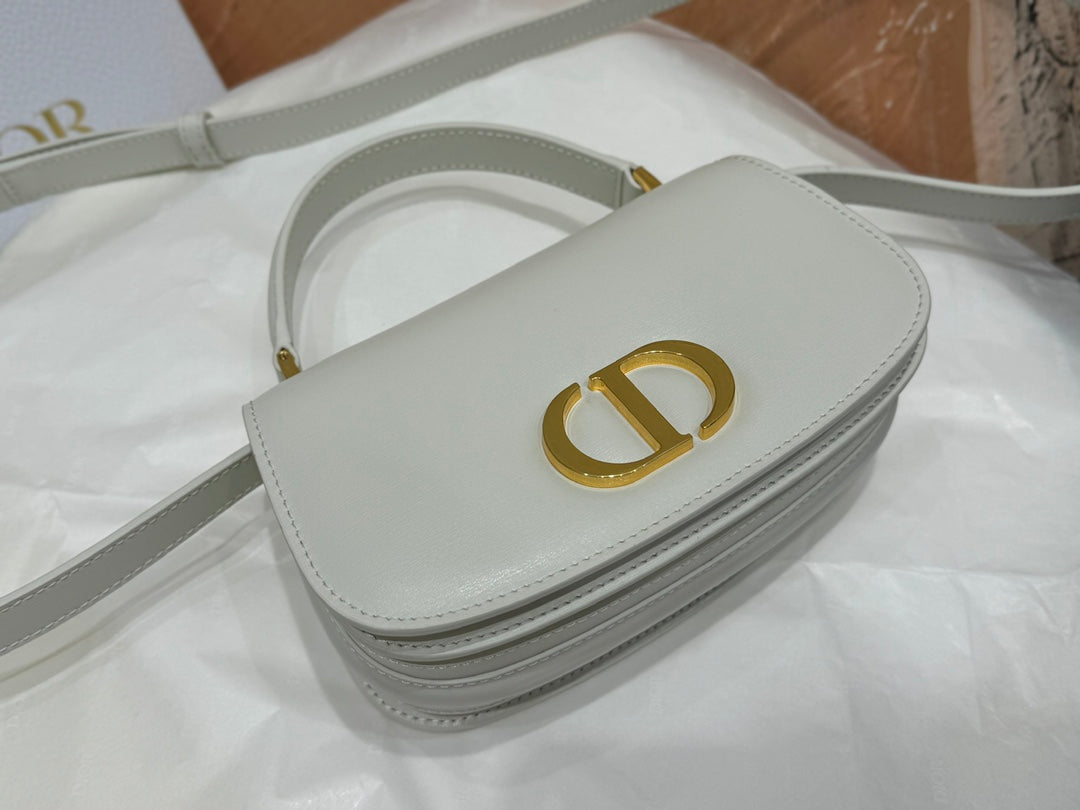 Luxury White Leather Top Handle Handbag with Gold-Tone Signature Logo and Adjustable Strap