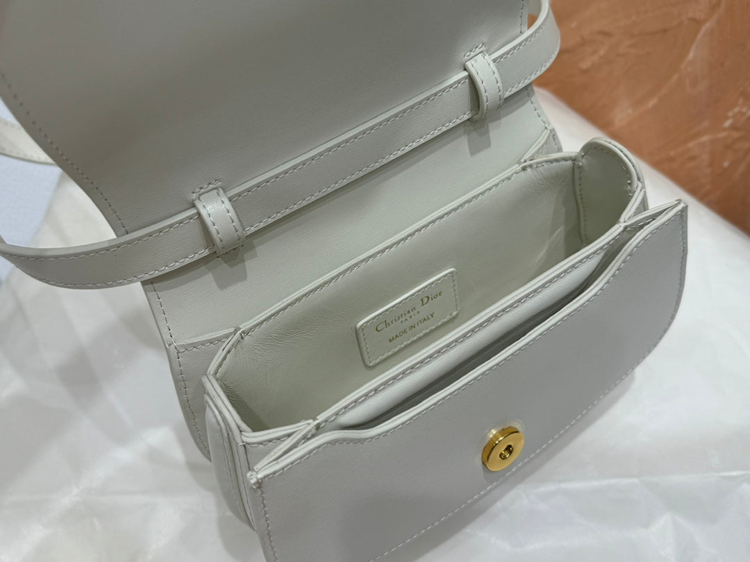Luxury White Leather Top Handle Handbag with Gold-Tone Signature Logo and Adjustable Strap