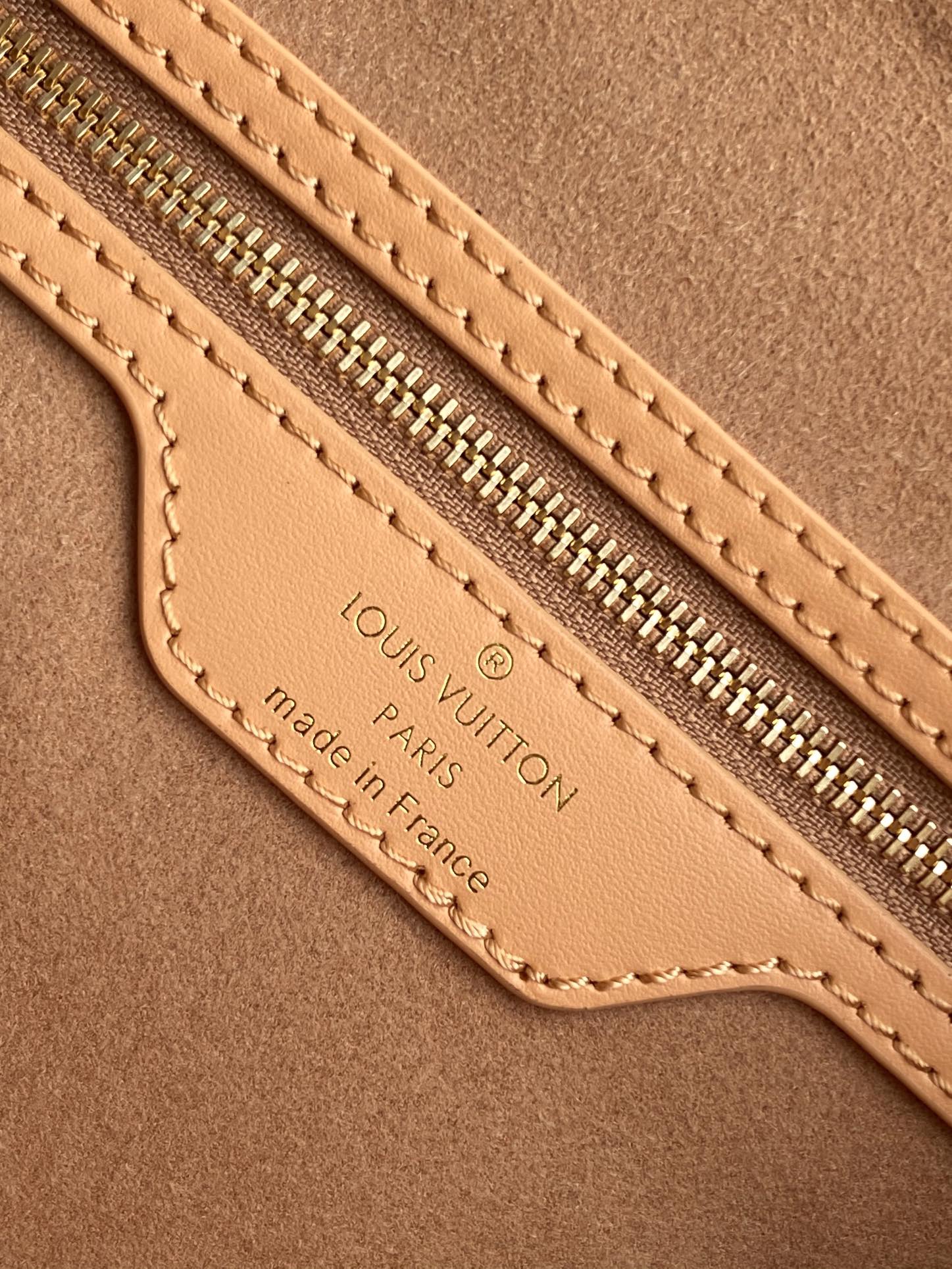 Elegant Tan Monogram Embossed Leather Satchel Bag with Top Handles and Crossbody Strap