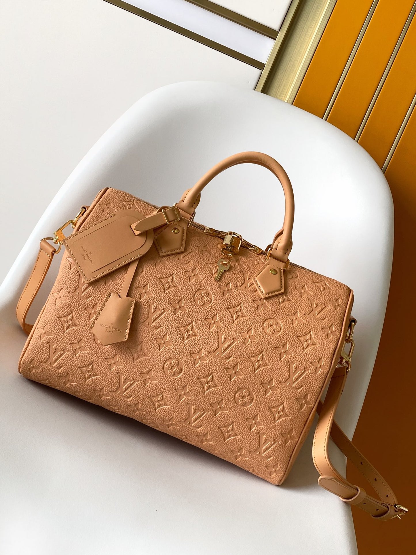 Elegant Tan Monogram Embossed Leather Satchel Bag with Top Handles and Crossbody Strap