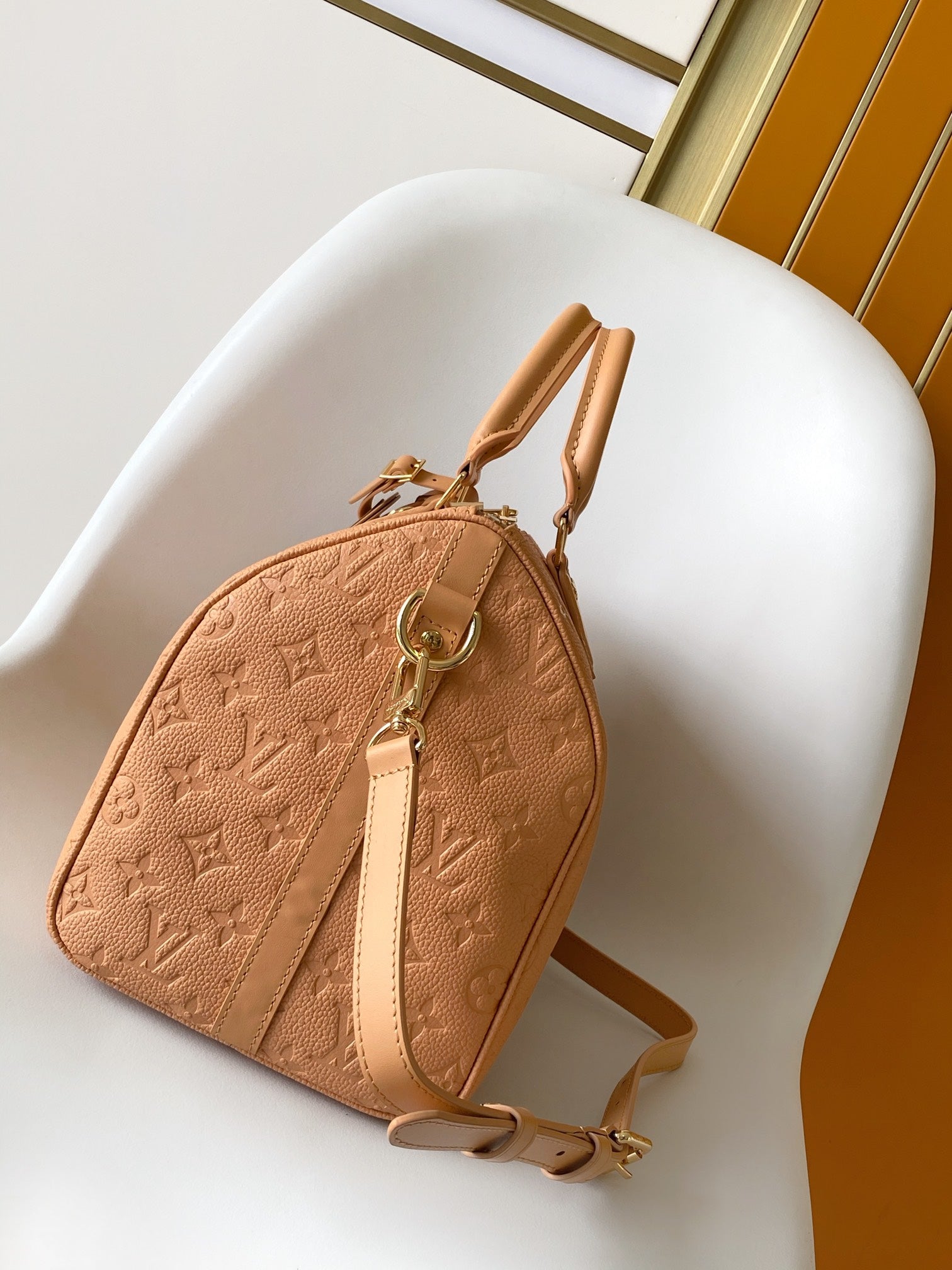 Elegant Tan Monogram Embossed Leather Satchel Bag with Top Handles and Crossbody Strap