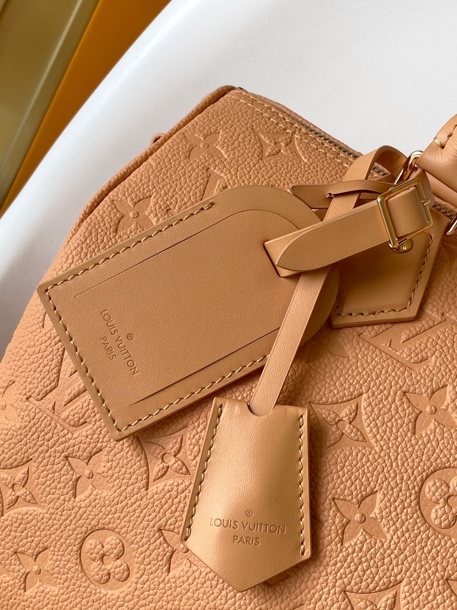 Elegant Tan Monogram Embossed Leather Satchel Bag with Top Handles and Crossbody Strap