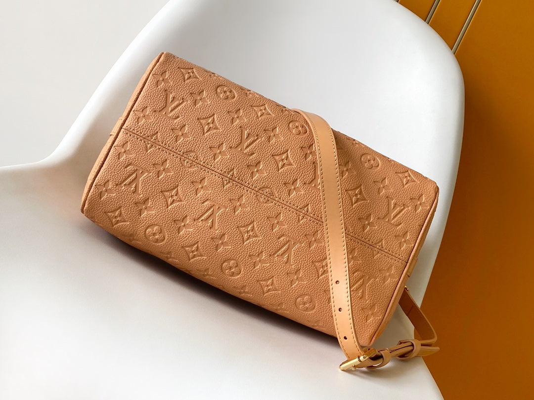 Elegant Tan Monogram Embossed Leather Satchel Bag with Top Handles and Crossbody Strap