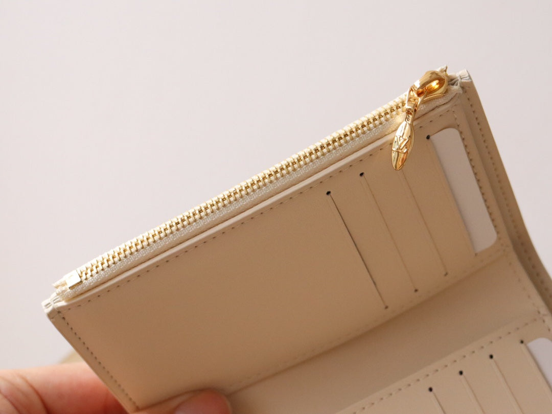 Louis Vuitton Capucines Compact Wallet - Cream Grained Leather with Gold LV Initials