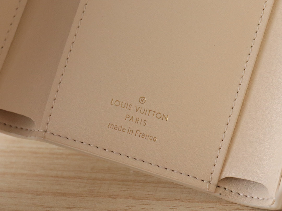 Louis Vuitton Capucines Compact Wallet - Cream Grained Leather with Gold LV Initials