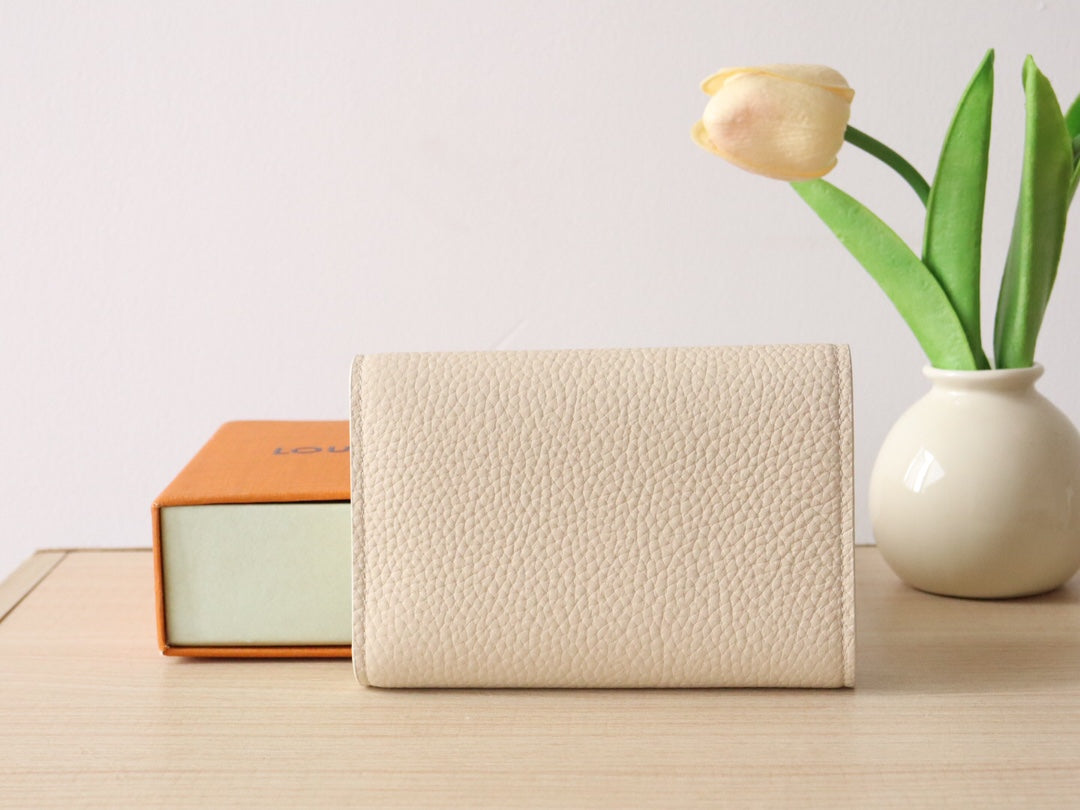 Louis Vuitton Capucines Compact Wallet - Cream Grained Leather with Gold LV Initials