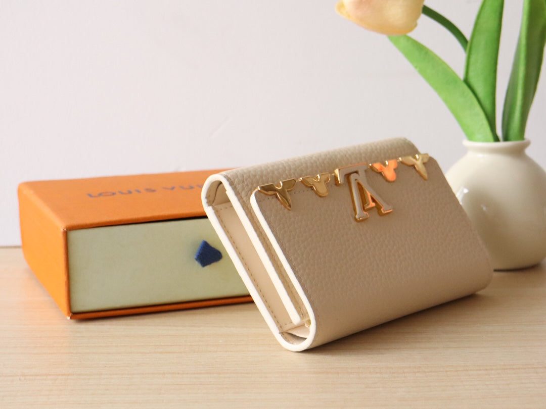 Louis Vuitton Capucines Compact Wallet - Cream Grained Leather with Gold LV Initials