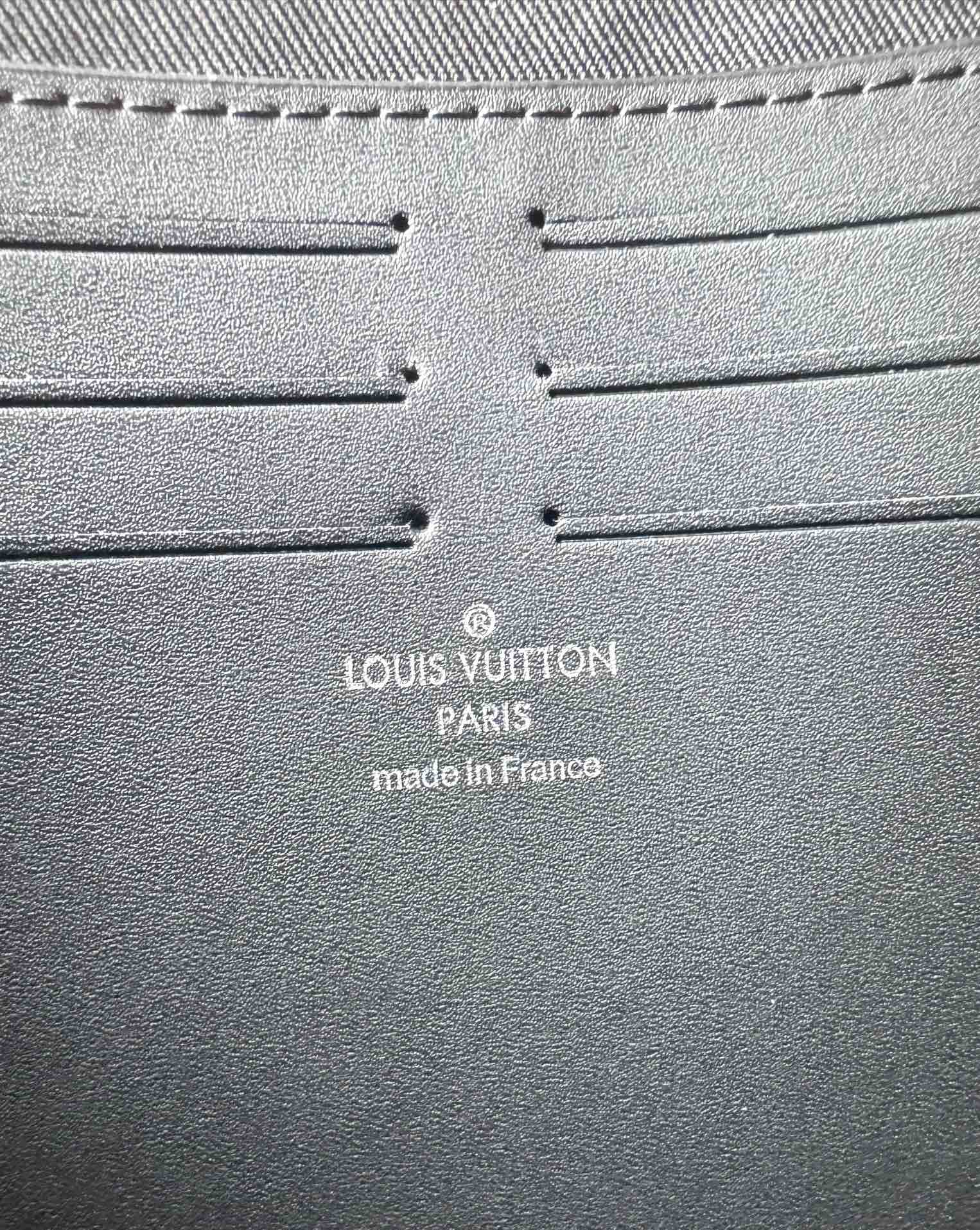 Luxury Black Embossed Monogram Zipper Clutch Bag - Sleek Designer Pouch
