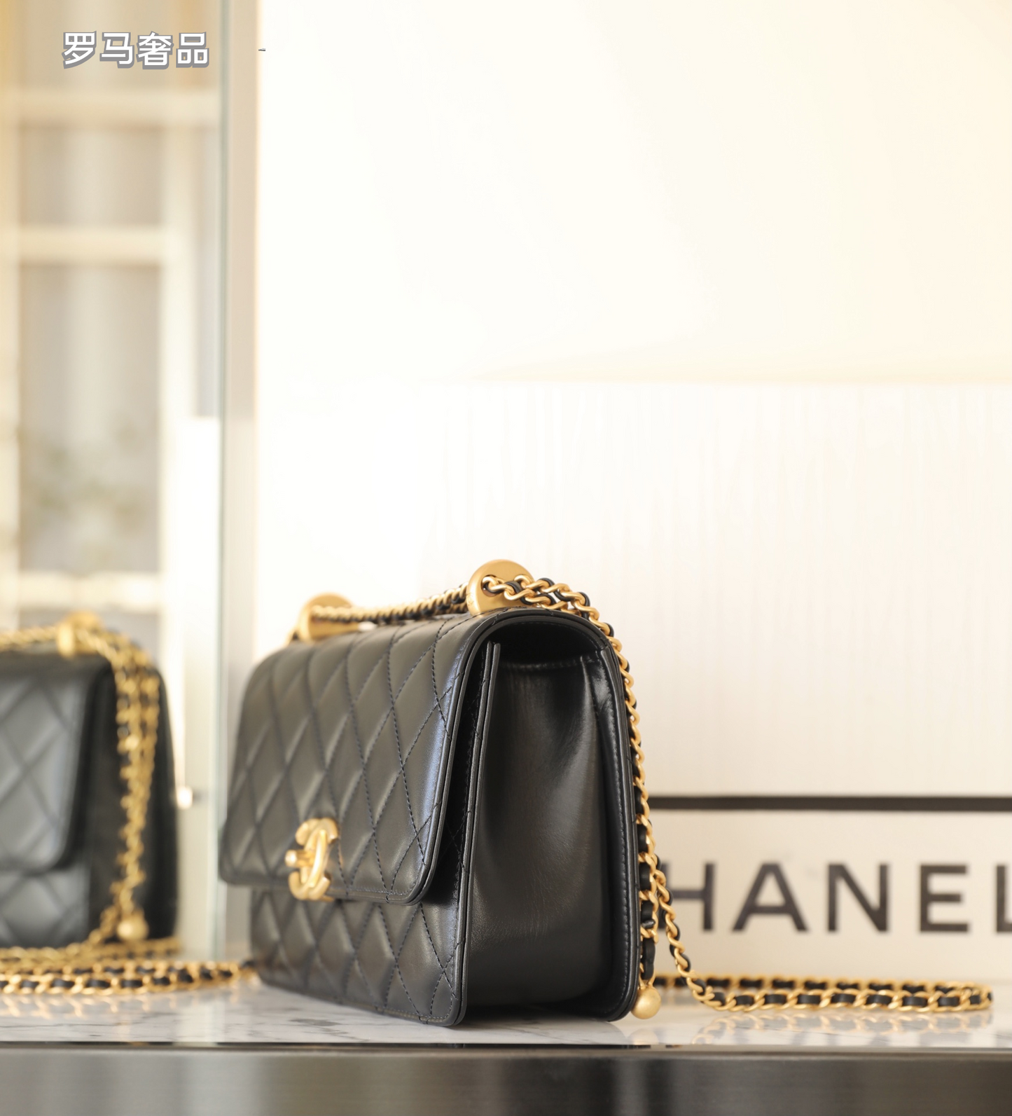 Chanel Black Quilted Lambskin Mini Flap Bag with Gold-Tone Hardware