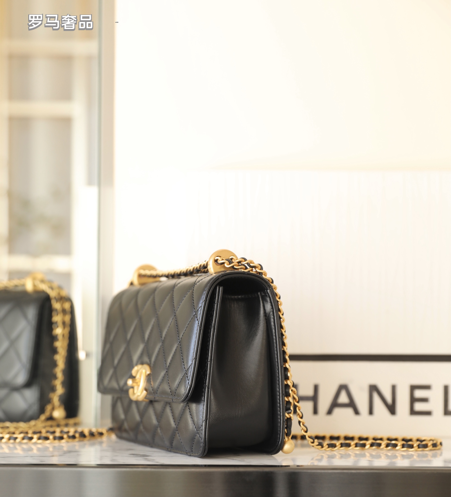 Chanel Black Quilted Lambskin Mini Flap Bag with Gold-Tone Hardware