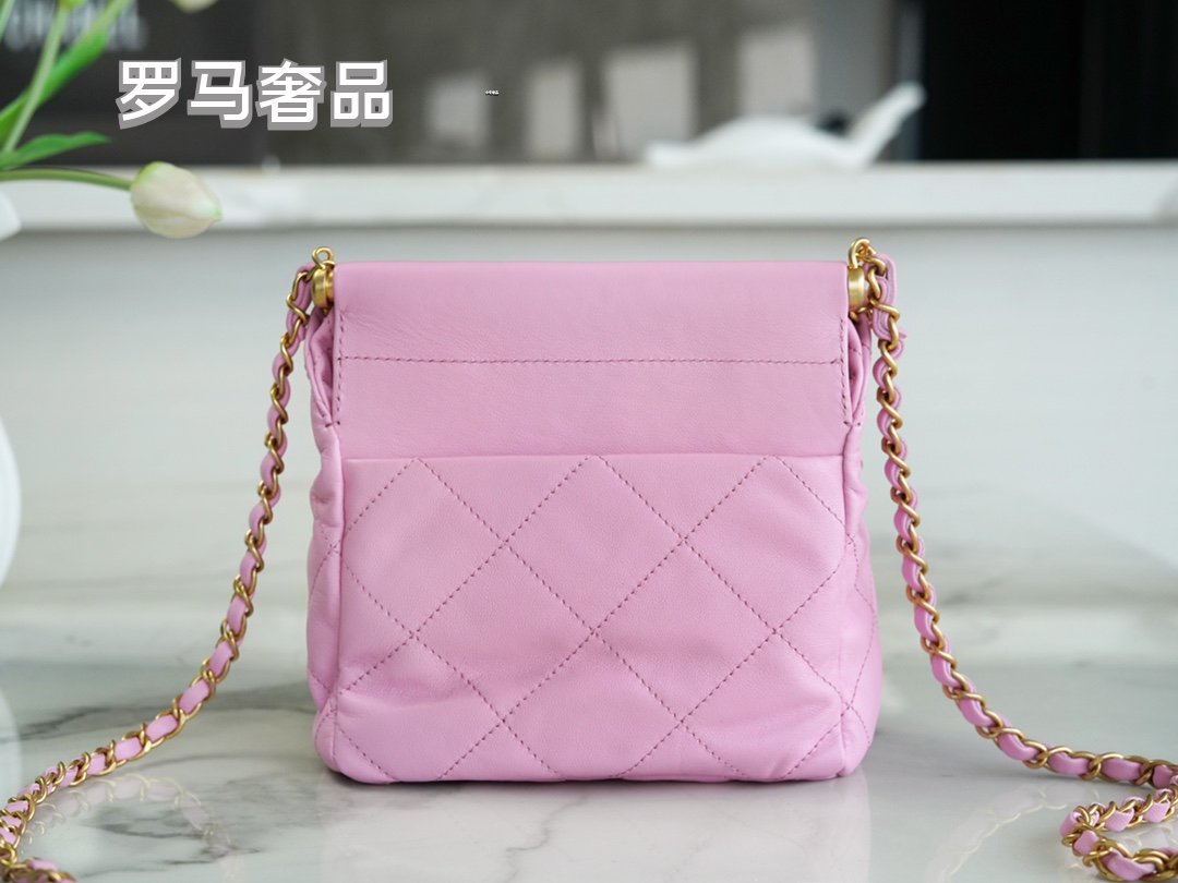 Pink Quilted Leather Bucket Bag with Gold-Tone Chain and Decorative Charms