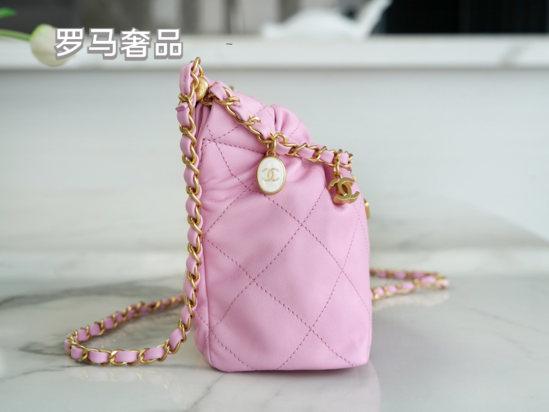 Pink Quilted Leather Bucket Bag with Gold-Tone Chain and Decorative Charms