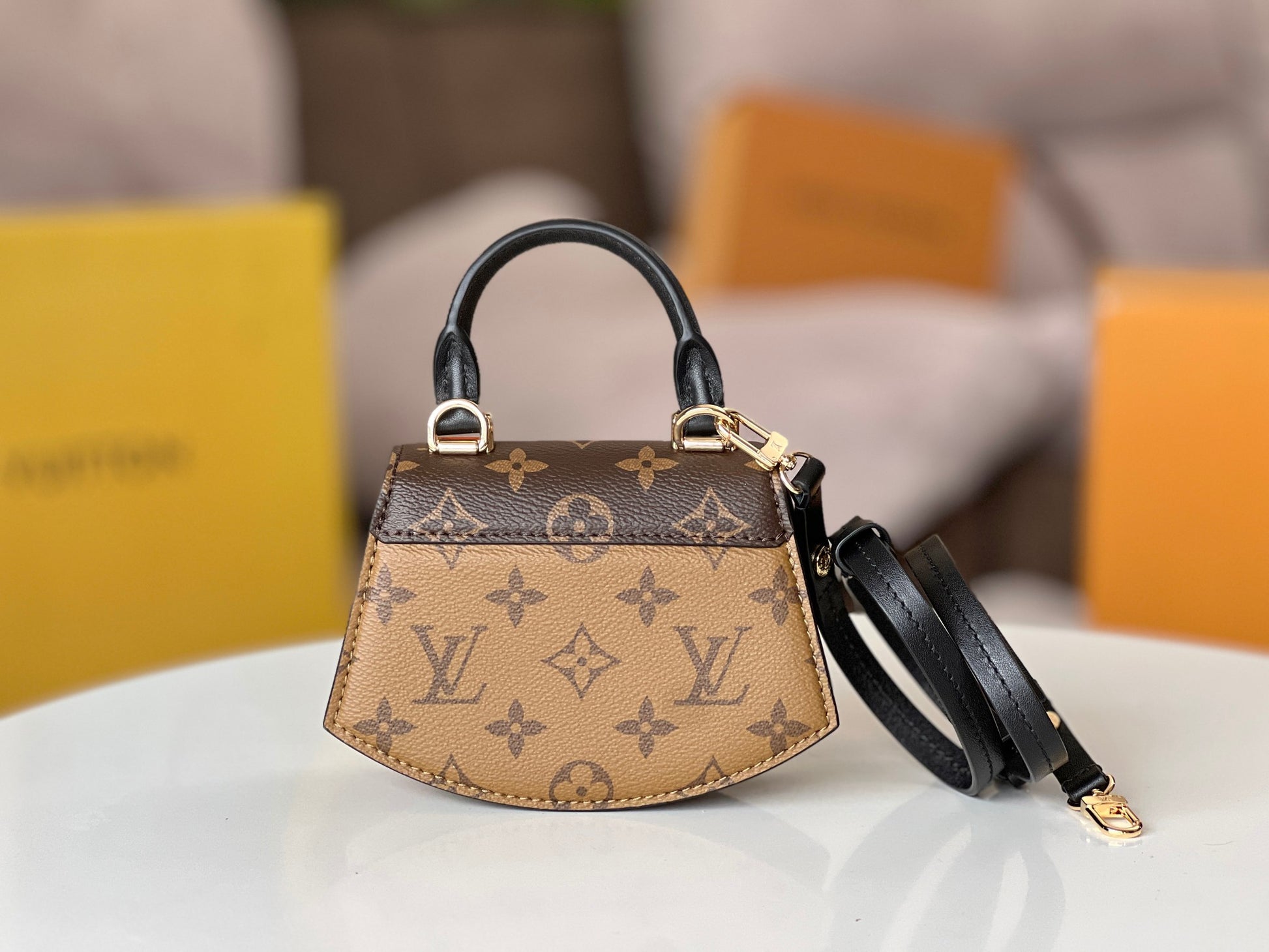 Louis Vuitton Tilcit Handbag Monogram and Monogram Reverse Canvas