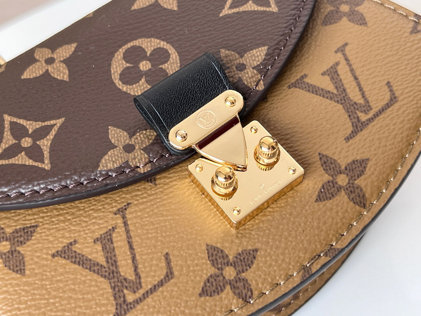 Louis Vuitton Tilcit Handbag Monogram and Monogram Reverse Canvas