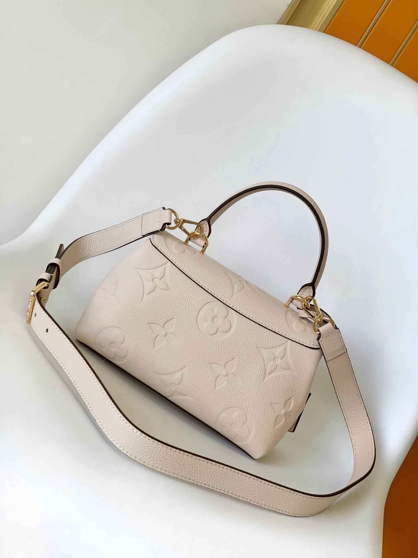 Louis Vuitton Elegant Cream Embossed Leather Top Handle Handbag with Shoulder Strap