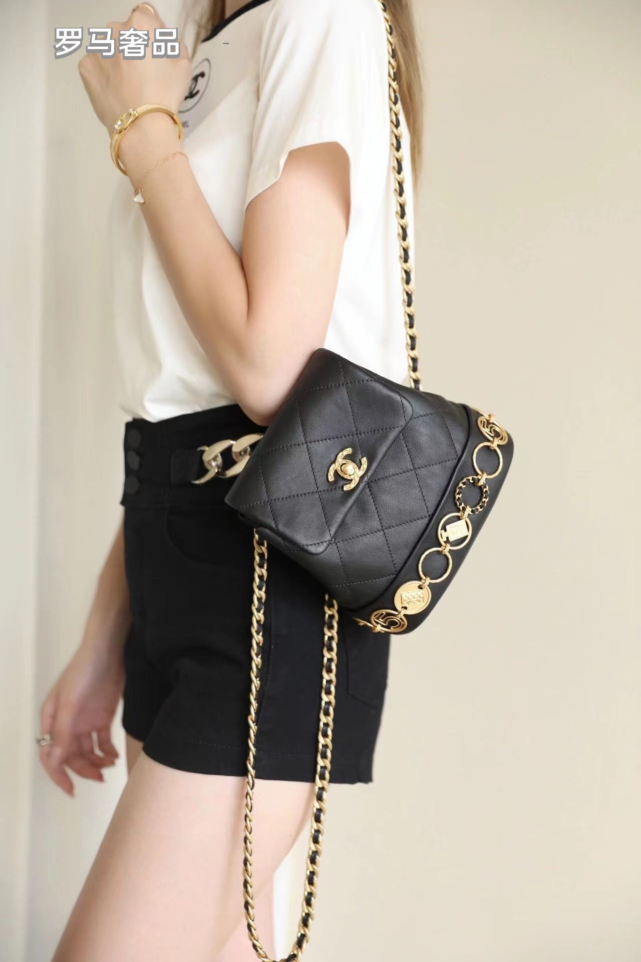 Chanel Vintage Mini Quilted Leather Backpack with Medallion Charm Chain Detail - Black/Gold
