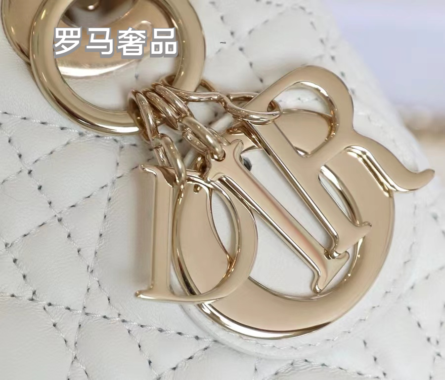 Elegant White Quilted Mini Handbag with Top Handle and Gold-Tone Charms