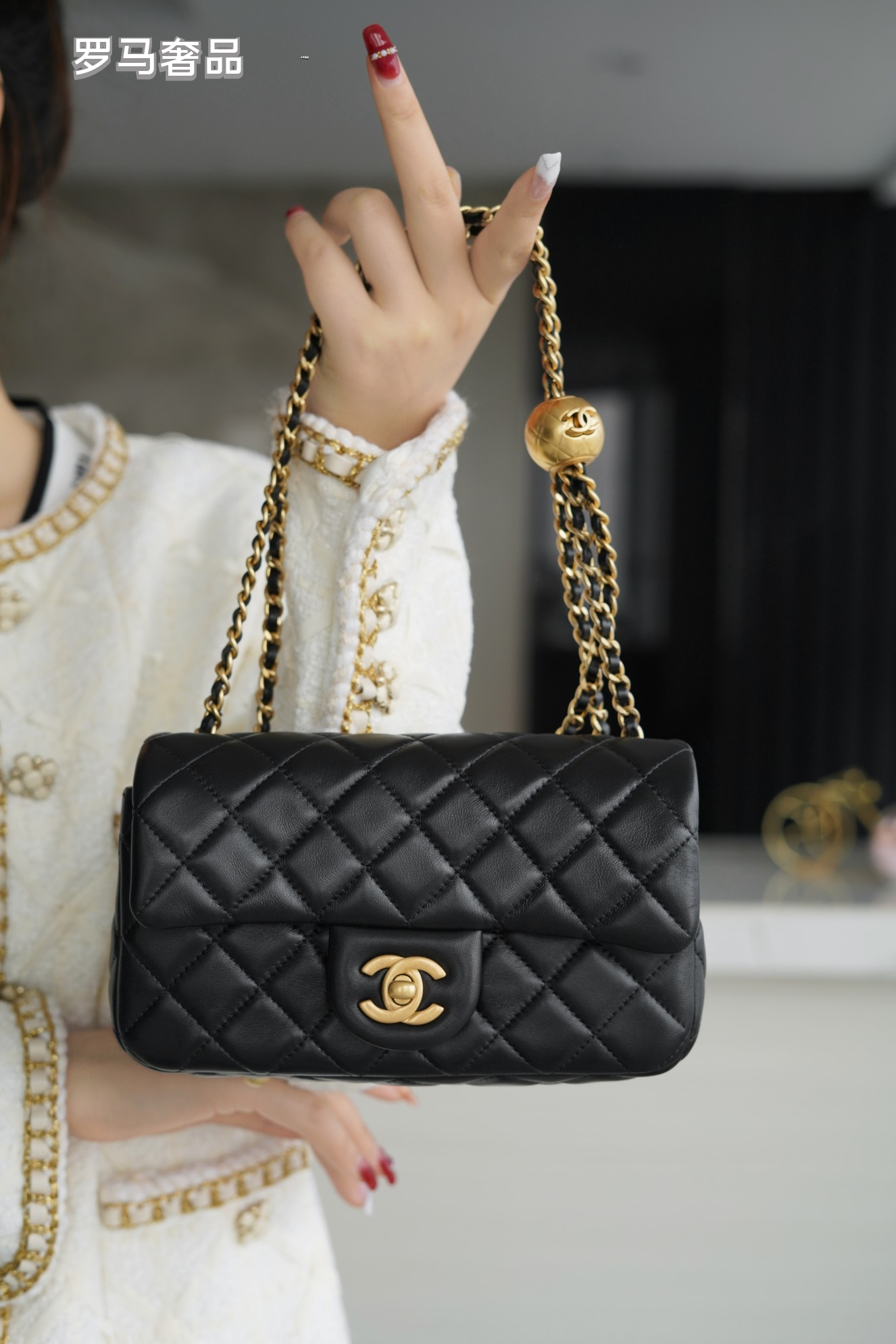 Luxury Quilted Black Leather Mini Flap Bag with Gold-Tone Chain and Ball Detail