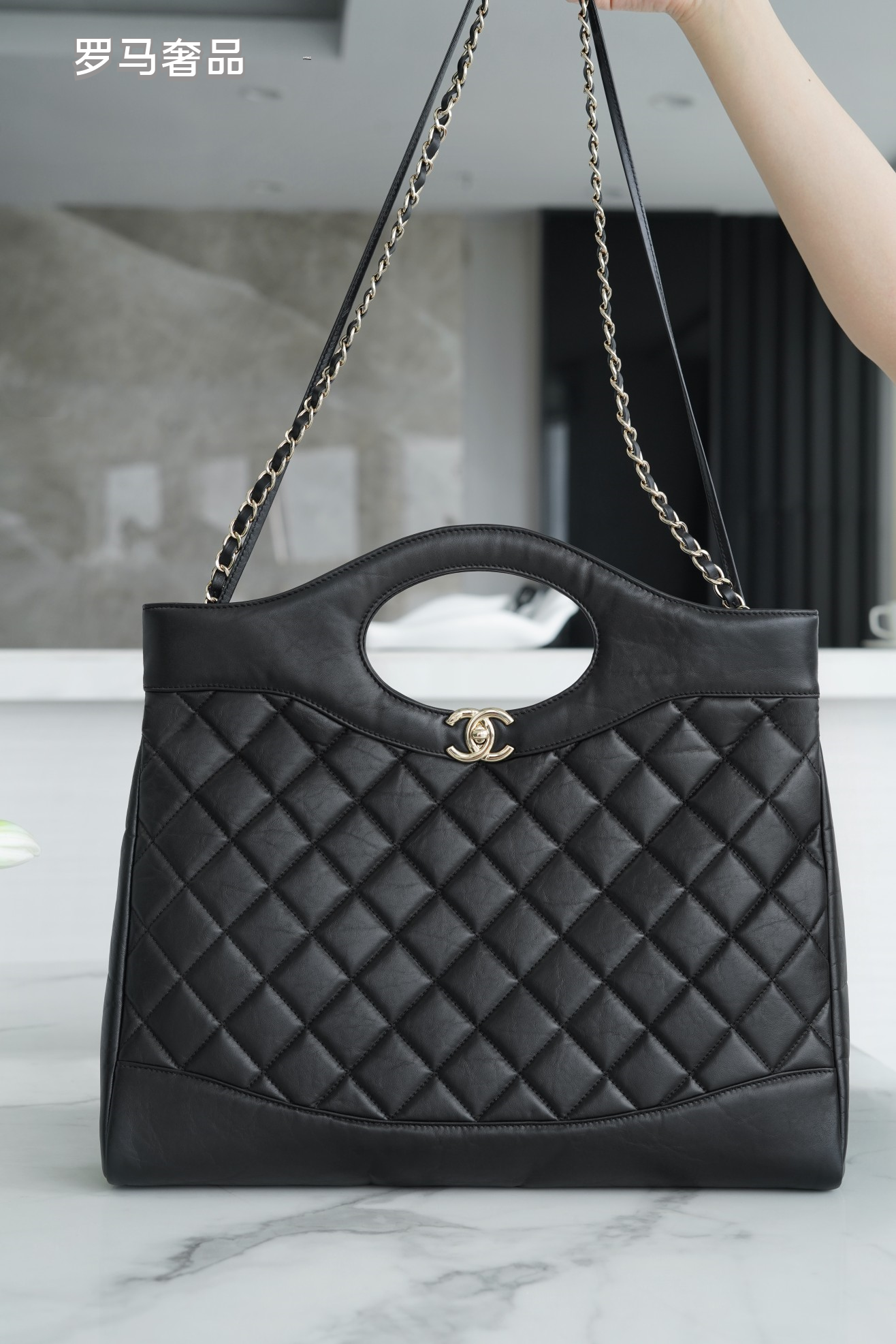 Luxury Black Quilted Leather Handbag with Gold-Tone Chain Strap and Cut-Out Handles
