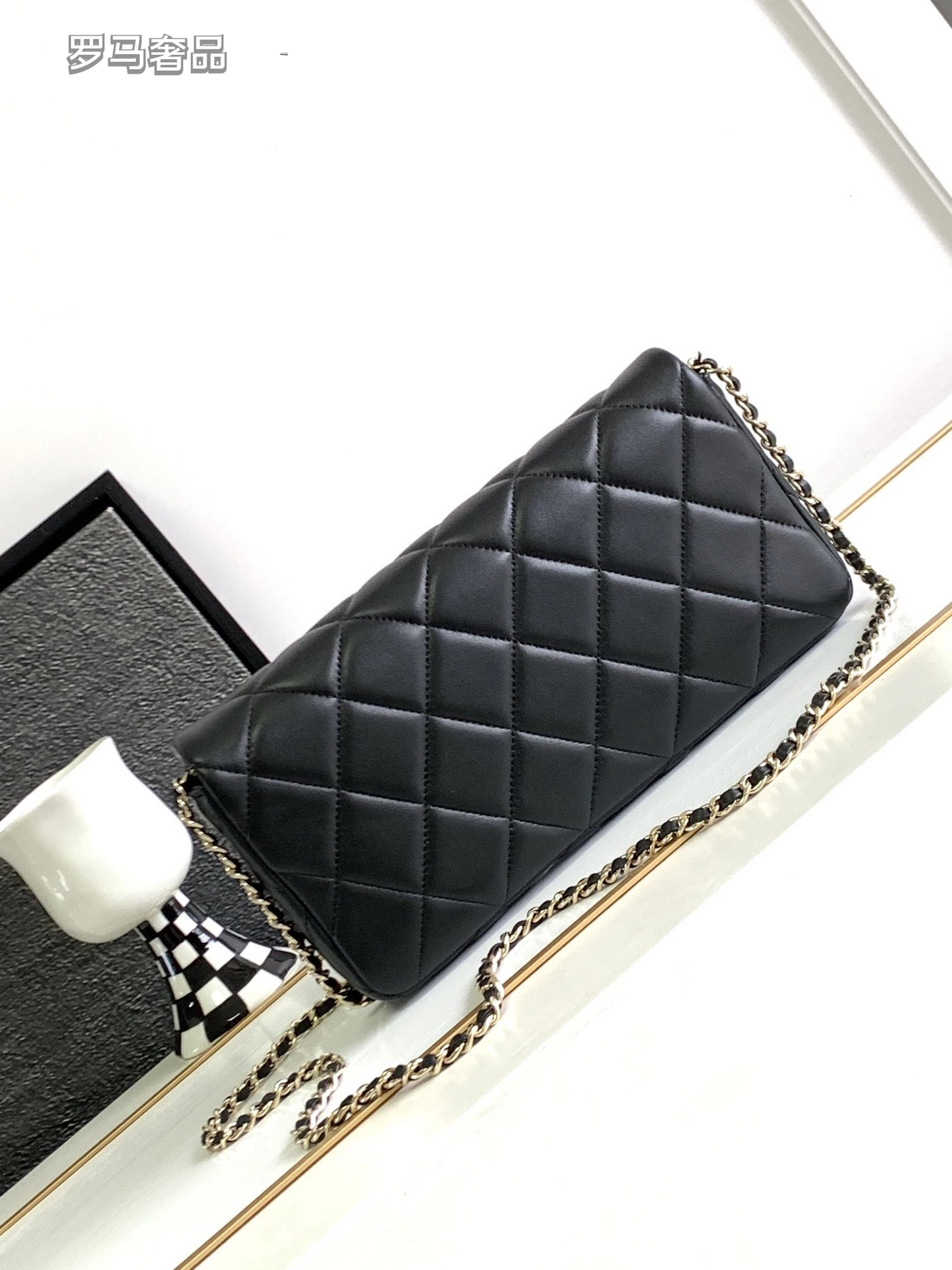 Black Quilted Leather Flap Bag with Crystal Interlocking Logo and Chain Strap