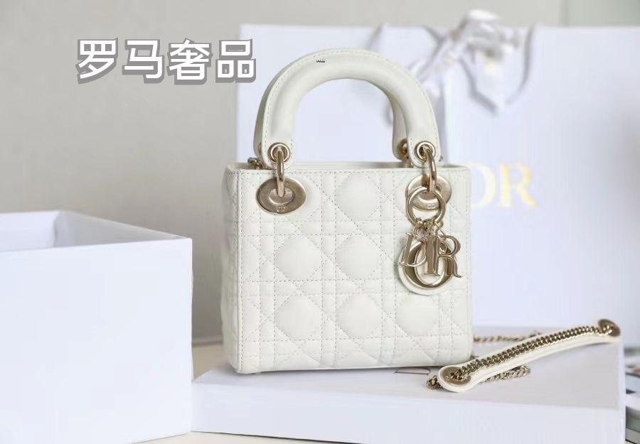 Elegant White Quilted Mini Handbag with Top Handle and Gold-Tone Charms